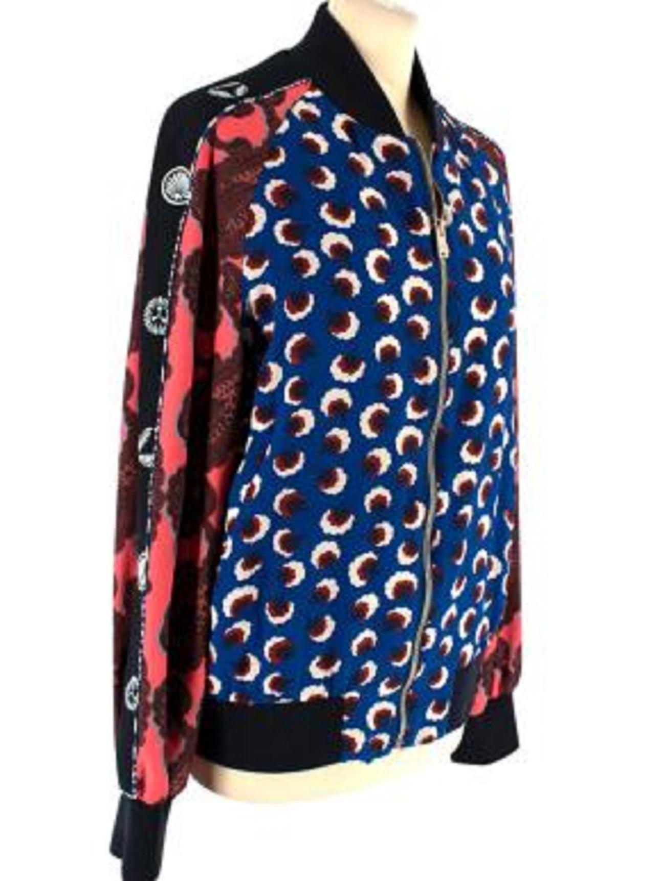 Stella McCartney Multi-Print Bomber Jacket

- Gold zip fastening
- Ribbed cuffs and neckline
- Fully lined
- Two pockets at the waist
- Blue floral printed body
- Red and black patterned sleeves

Material:
Fabric 1 (outer fabric): 100% Silk
Fabric
