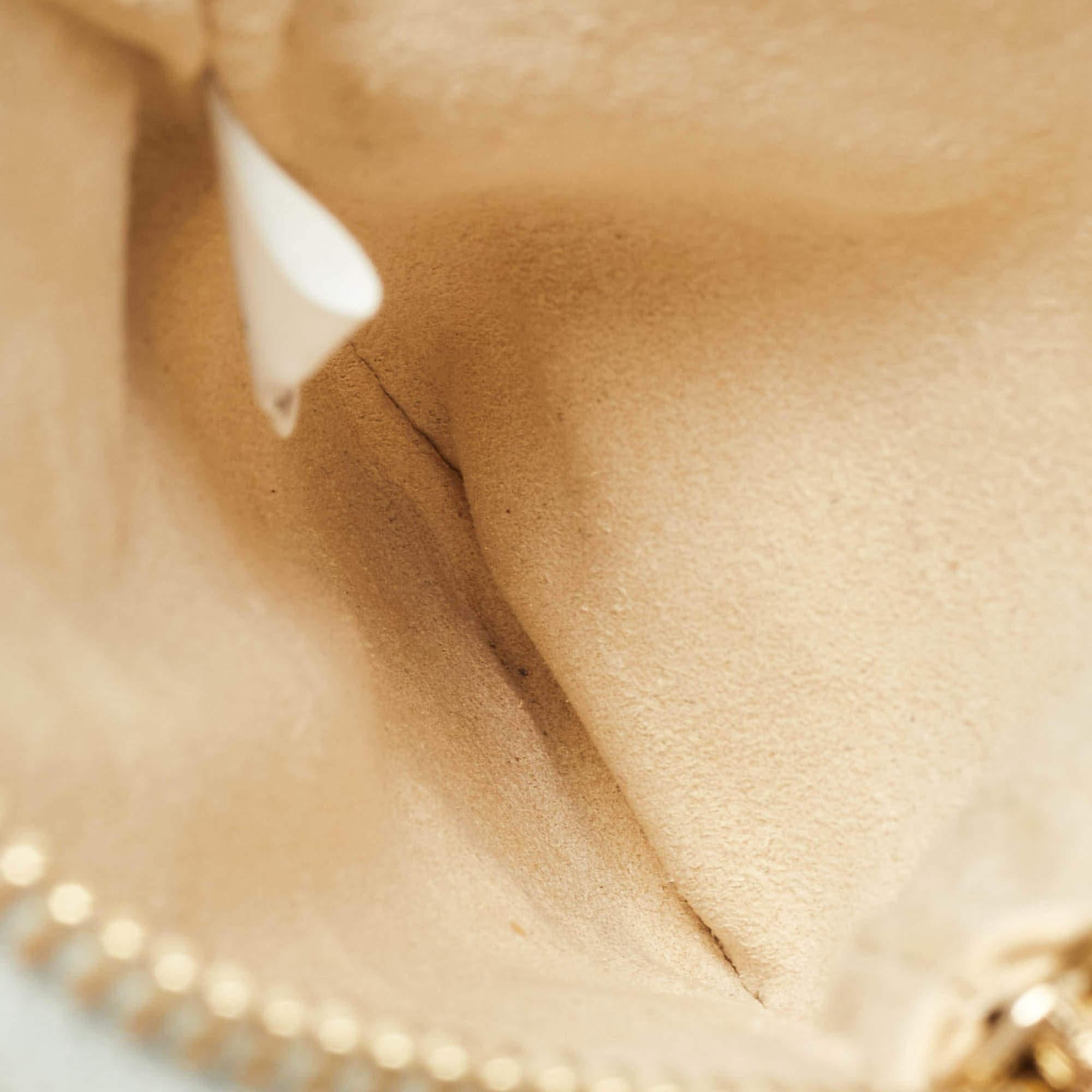 Stella McCartneys reign of class and elegance leaves speechless time after time. This fabulous purse joins convenience with utter style and comes in an unique silhouette. Made from faux leather its trendy appeal is enhanced with gold tone accents
