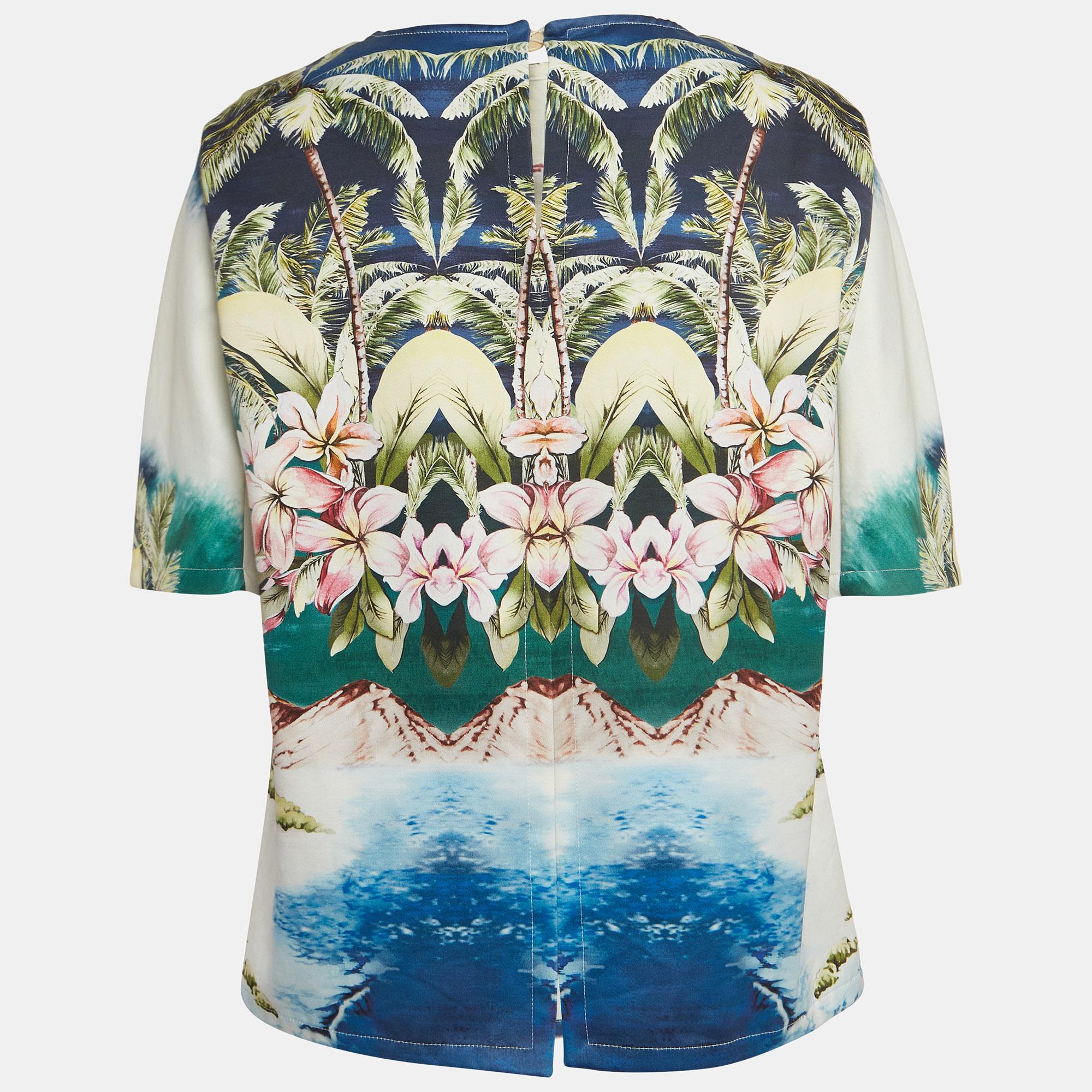 The Stella McCartney Multicolor top is a vibrant and chic piece that exudes summer charm. Crafted from premium cotton, it features a playful Hawaiian print, complemented by buttoned back detailing for a touch of sophistication. Perfect for adding a