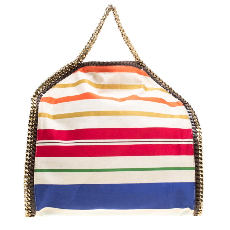 Stella McCartney is known for her chic designs and this Falabella tote perfectly embodies this trait. Crafted in Italy from multicolor canvas with a fabric interior, this tote has a beautiful striped exterior and gold-tone chain details at its