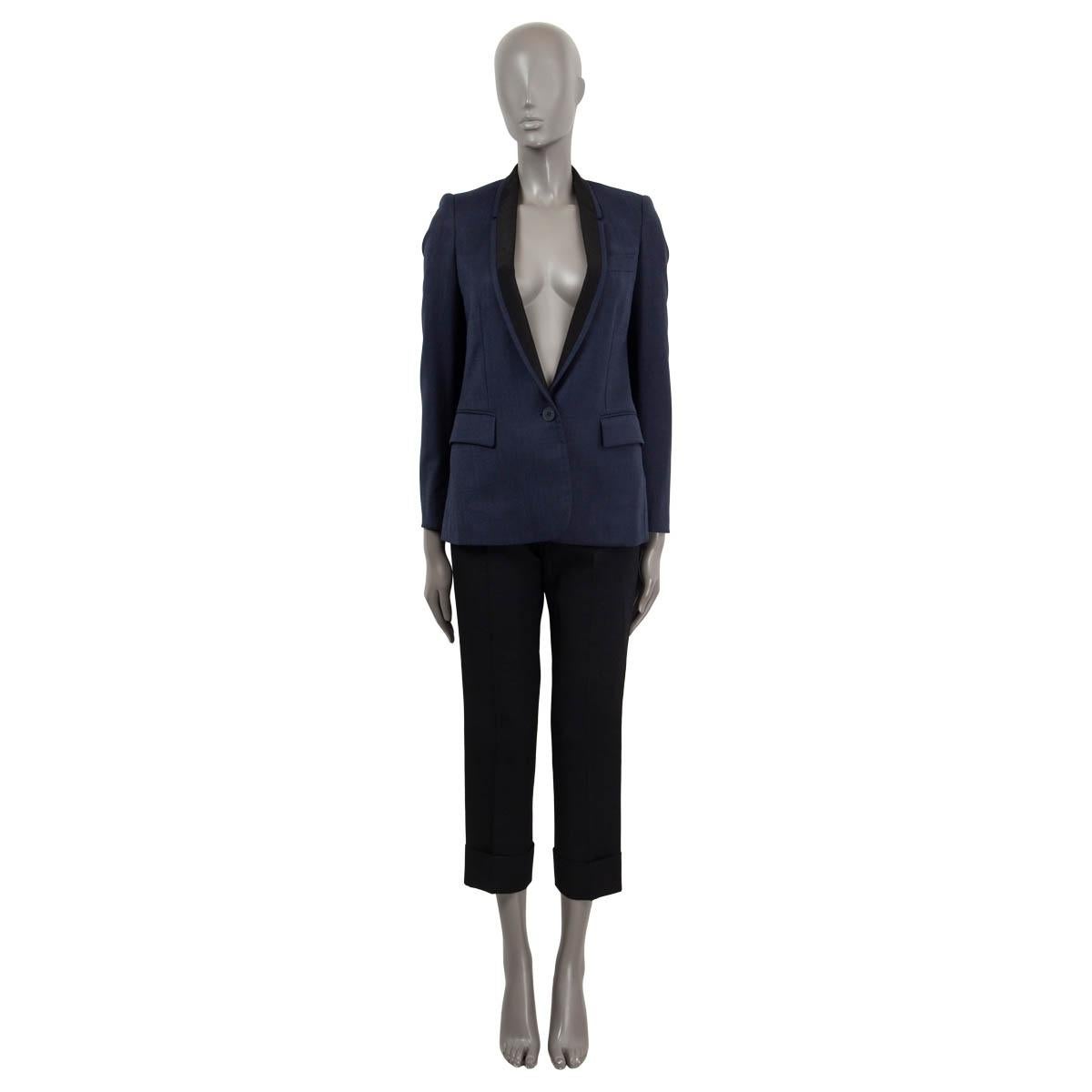 100% authentic Stella McCartney shawl collar single button blazer in navy and black wool (100%), rayon (100%), rayon (52%) and cotton (48%). Features two flap pockets on the front and one chest pocket. Lined in blue rayon (100%). Has been worn and