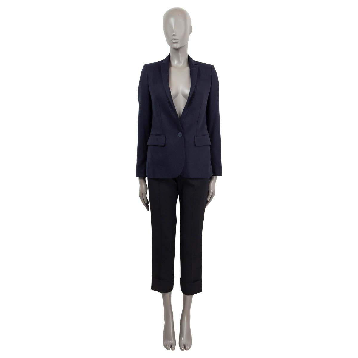 100% authentic Stella McCartney single button blazer in navy wool (100%), rayon (52%) and cotton (48%) with notch collar. Closes with single button and has flap pockets. Lined in navy rayon (100%). Has been worn and is in excellent