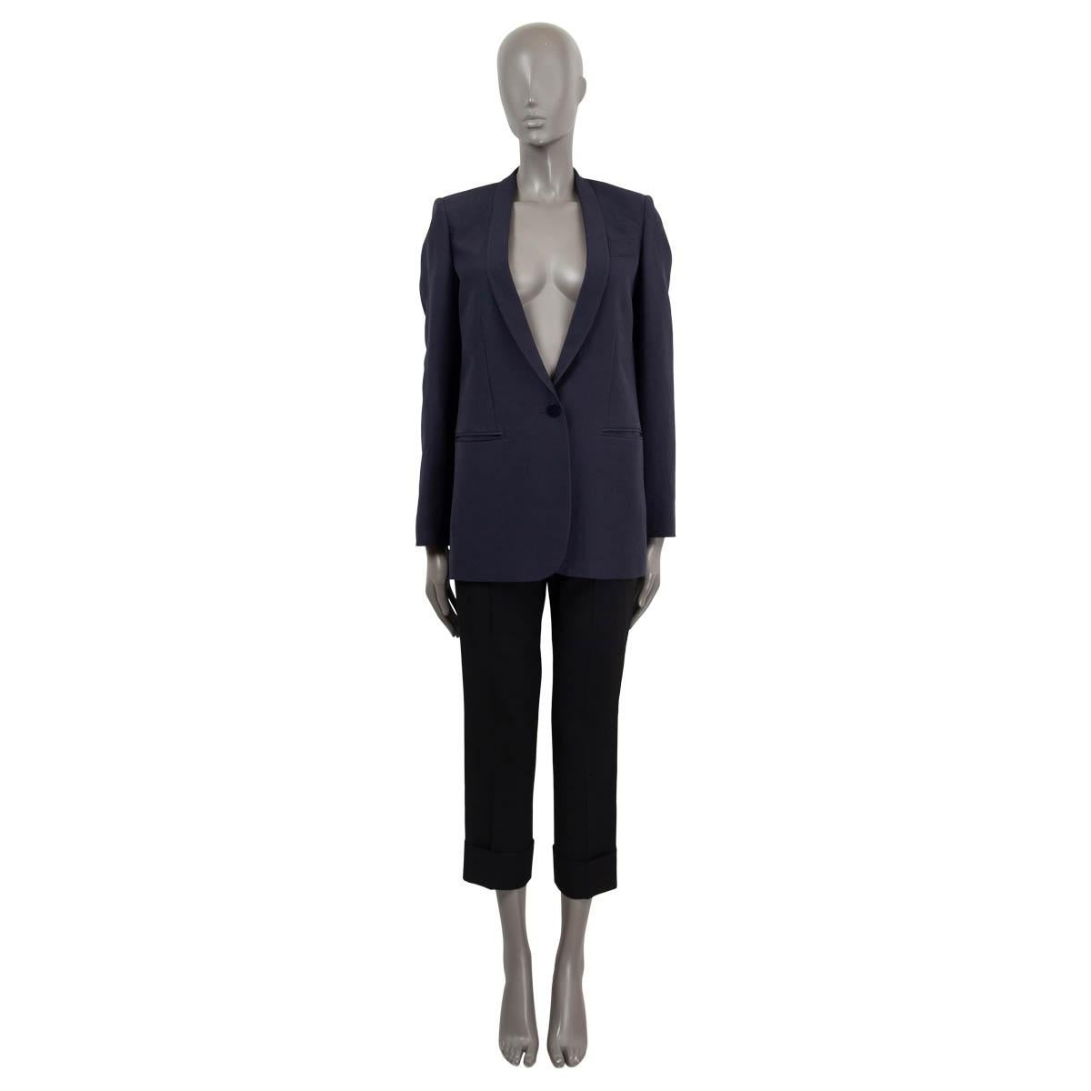 100% authentic Stella McCartney shawl collar one single button blazer in navy wool (69%) and silk (31%). Features two slit pockets on the front and one chest pocket. Lined in rayon (52%) and cotton (48%). Has been worn and is in excellent