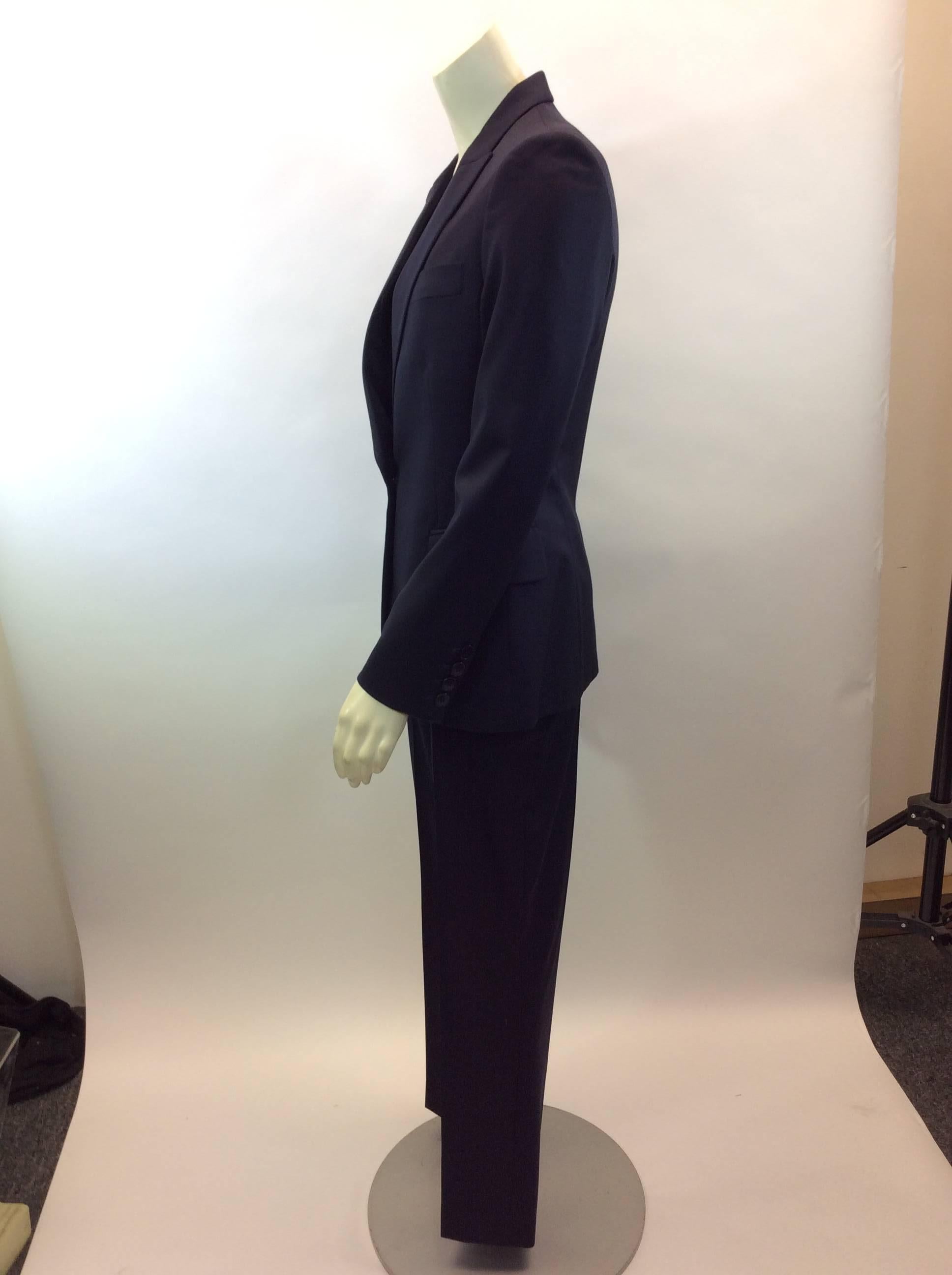 Stella McCartney Navy Pant Suit
$599
Made in Hungary
100% Wool 
Size 40
Jacket:
Length 27