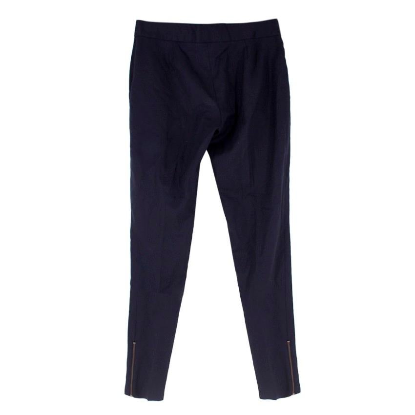 Stella McCartney Navy Wool Casual Trousers
 
 - Navy wool casual trousers
 - Lightweight
 - Centre-front concealed hook-and-eye and zip fastening
 - Front side pockets
 - Zipped hem
 
 Please note, these items are pre-owned and may show some signs