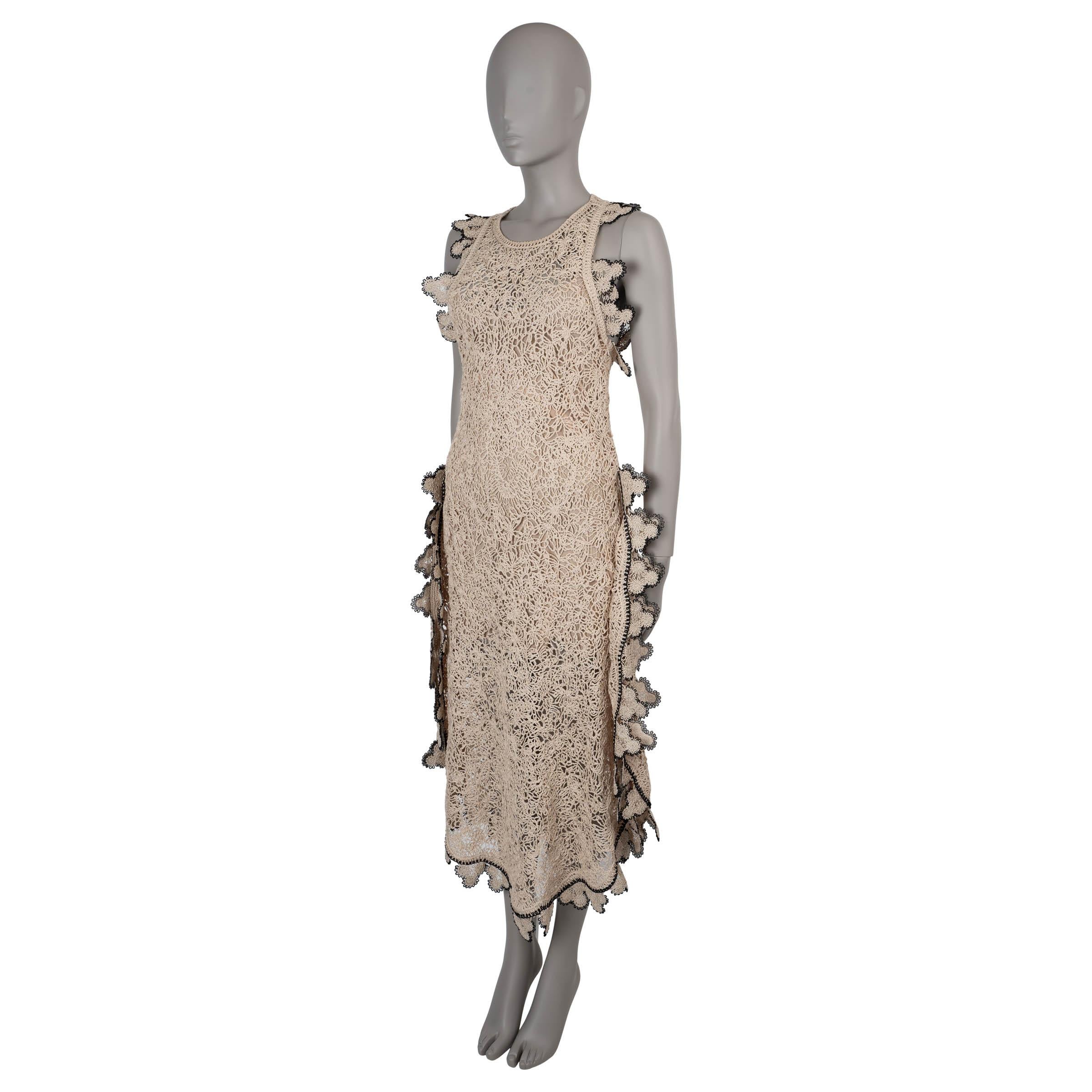 This 100% authentic Stella McCartney crochet lace midi dress is crafted in a beautiful nude cotton (please note the content tag is missing). It features a fitted, sleeveless top and a voluminous skirt with side slits for a feminine and flattering