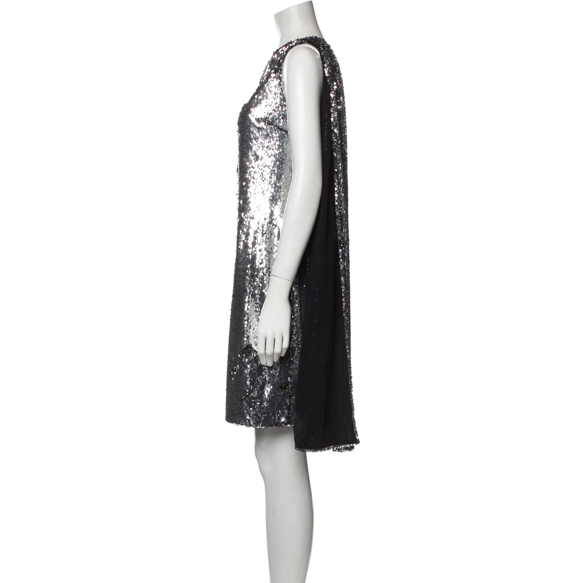 Stella McCartney Shift Dress. Silver. Sequin Embellishments. Sleeveless with One-Shoulder. Concealed Zip Closure at Side. Designer Fit: Dresses by Stella McCartney typically fit true to size.

Color: Silver
Material: 100% Polyurethane; Lining 100%
