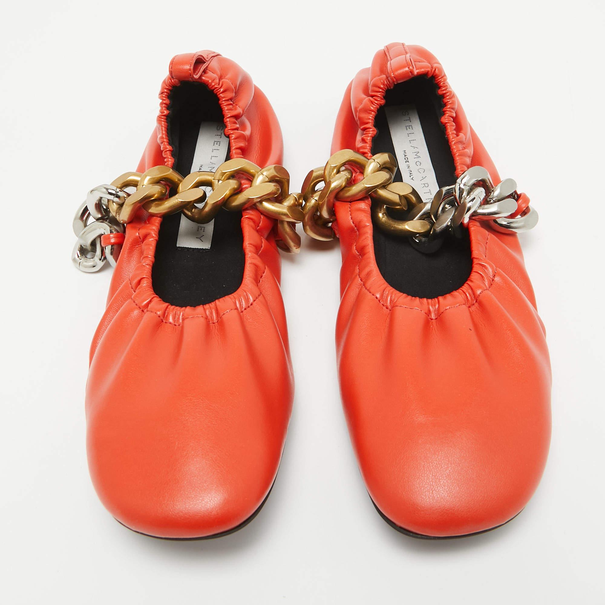 Experience a blend of style and comfort with the Stella McCartney Orange Faux Leather Falabella Soft Ballet Flats. These chic flats feature a soft faux leather design accented by the signature Falabella chain trim. With their versatile hue and