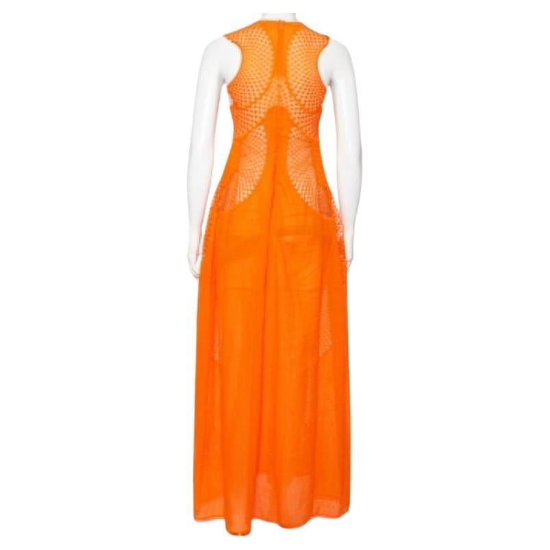 How beautiful is this dress from the House of Stella McCartney! This dress, with its fluid-feminine silhouette and charming design, will easily add grace to your attire. It has been tailored using orange lace and enhanced with mesh insets and a maxi