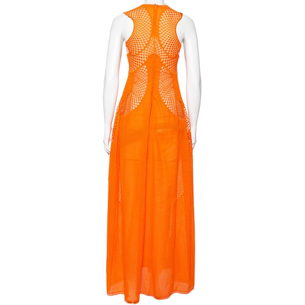 How beautiful is this dress from the House of Stella McCartney! This dress, with its fluid-feminine silhouette and charming design, will easily add grace to your attire. It has been tailored using orange lace and enhanced with mesh insets and a maxi