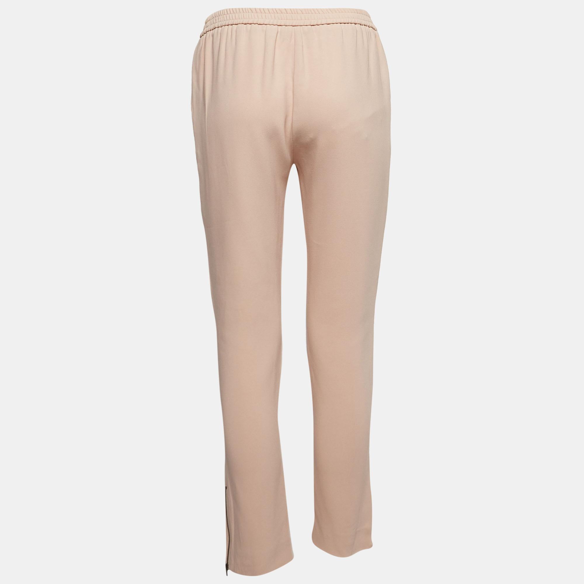 Experience the perfect fusion of comfort and sophistication with these Stella McCartney women's trousers. Meticulously designed, they exude versatility and elegance, ensuring you look and feel confident throughout your day.

