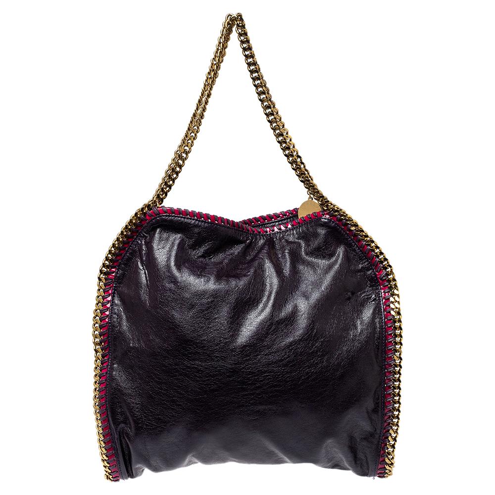 Stella McCartney's Falabella bag exemplifies the label's rock-chic appeal. The chain straps and whipstitched edges make the bag instantly recognizable. This version has been made from faux leather in a metallic black hue and has a fabric-lined