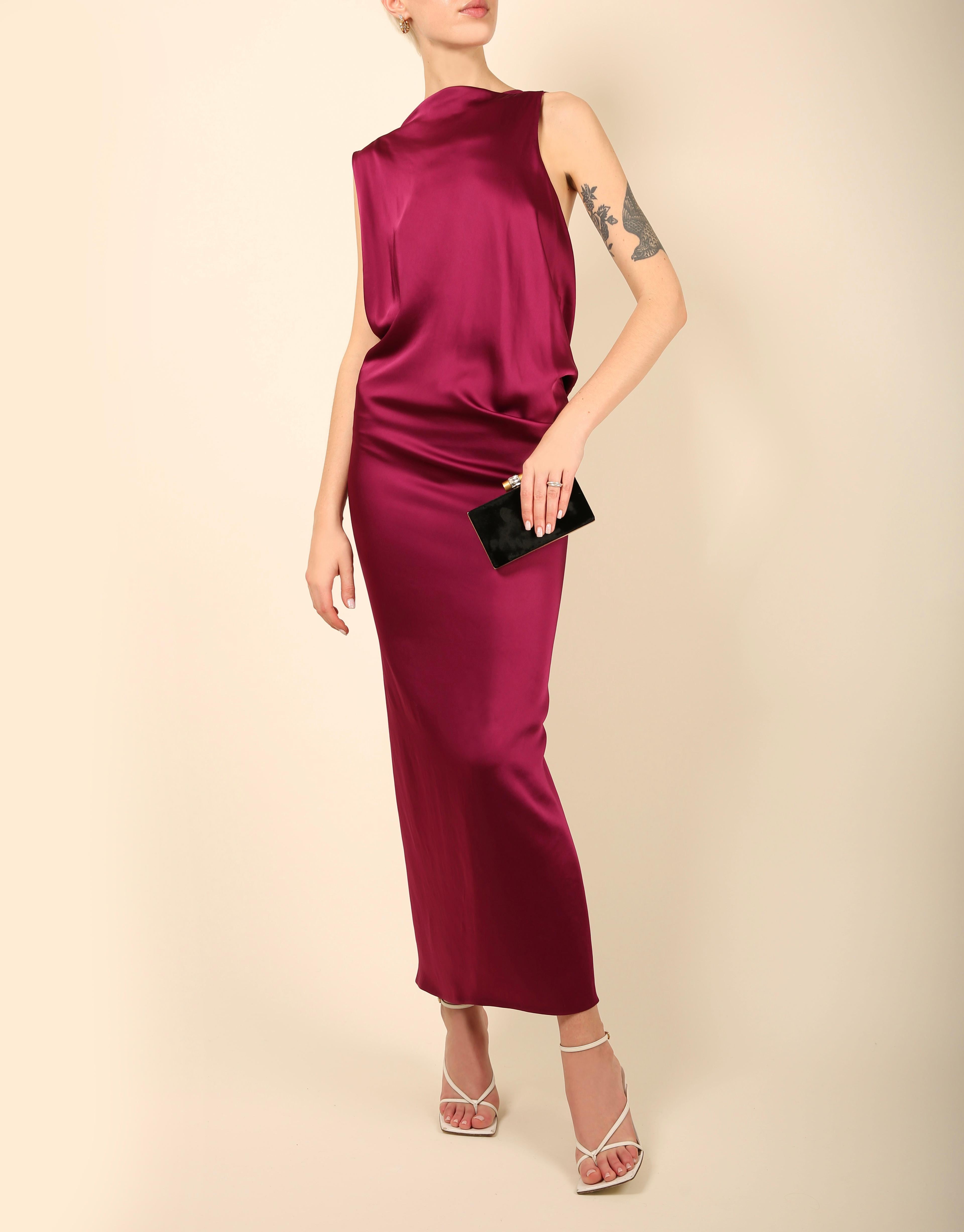 A beautiful floor length dress by Stella McCartney
Please take note that our model is very tall so measurements are listed below to determine the length
Deep shade of magenta 
Sleeveless with a completely backless cut and two semi asymmetrical