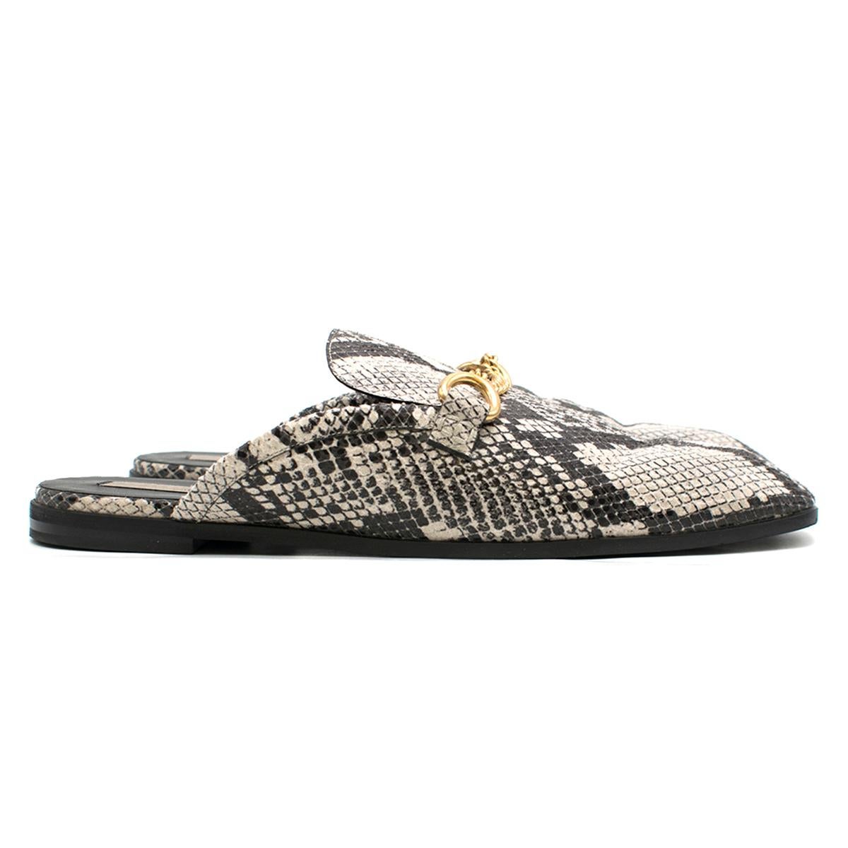 Stella McCartney Python-Effect Faux-Leather Backless Loafers

- Faux-leather Loafers
- Python-effect
- Backless style, slip on
- Gold toned hardware, ring and chain embellishment 
- Black sole

This item comes with an additional dust bag. 

Please
