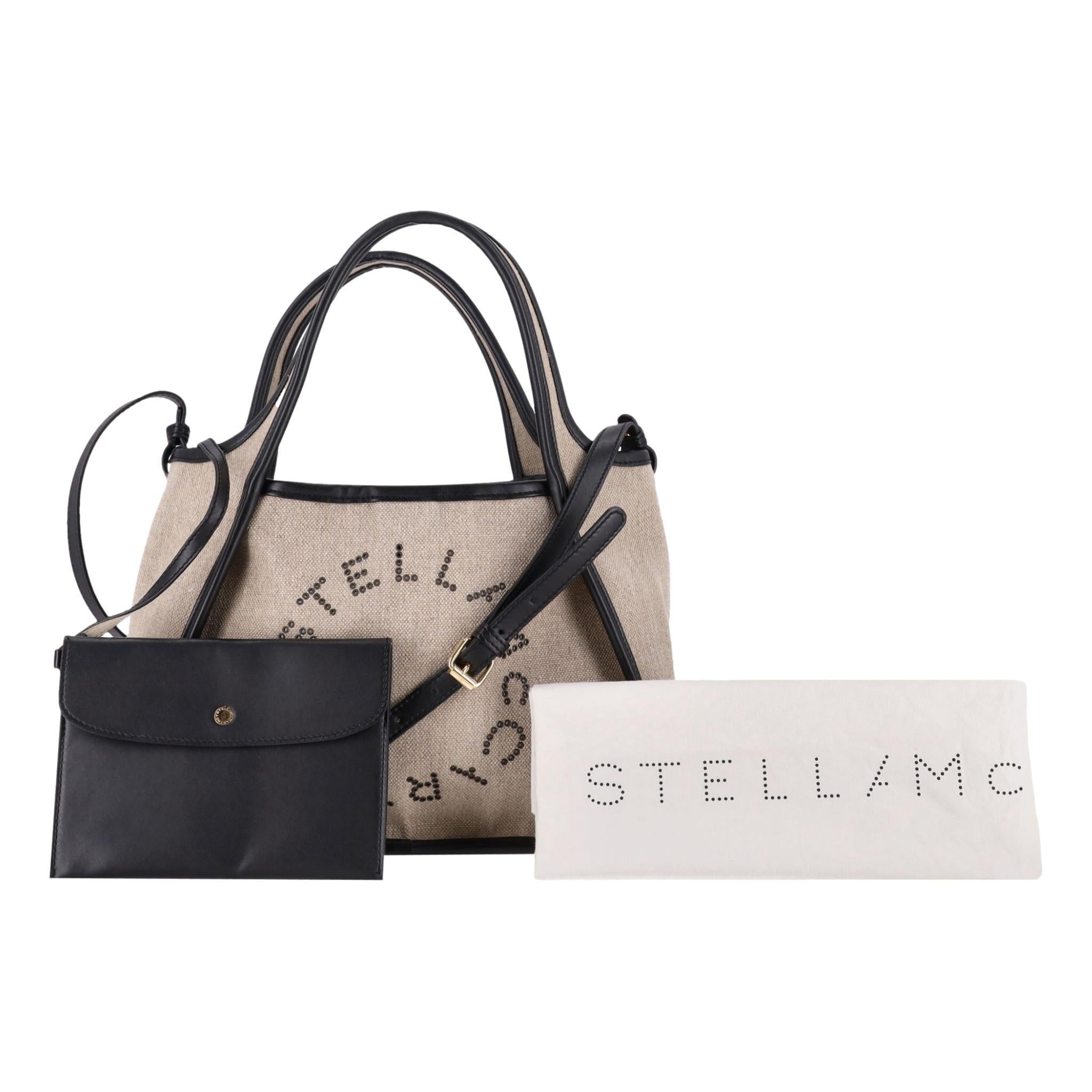 Stella McCartney Salt & Pepper Logo Tote Bag

Light beige linen canvas woven bag designed with black vegan leather trim.

Featuring logo to the front, detachable, adjustable shoulder strap and dual top handles.

Comes with a removable pouch.

Rrp