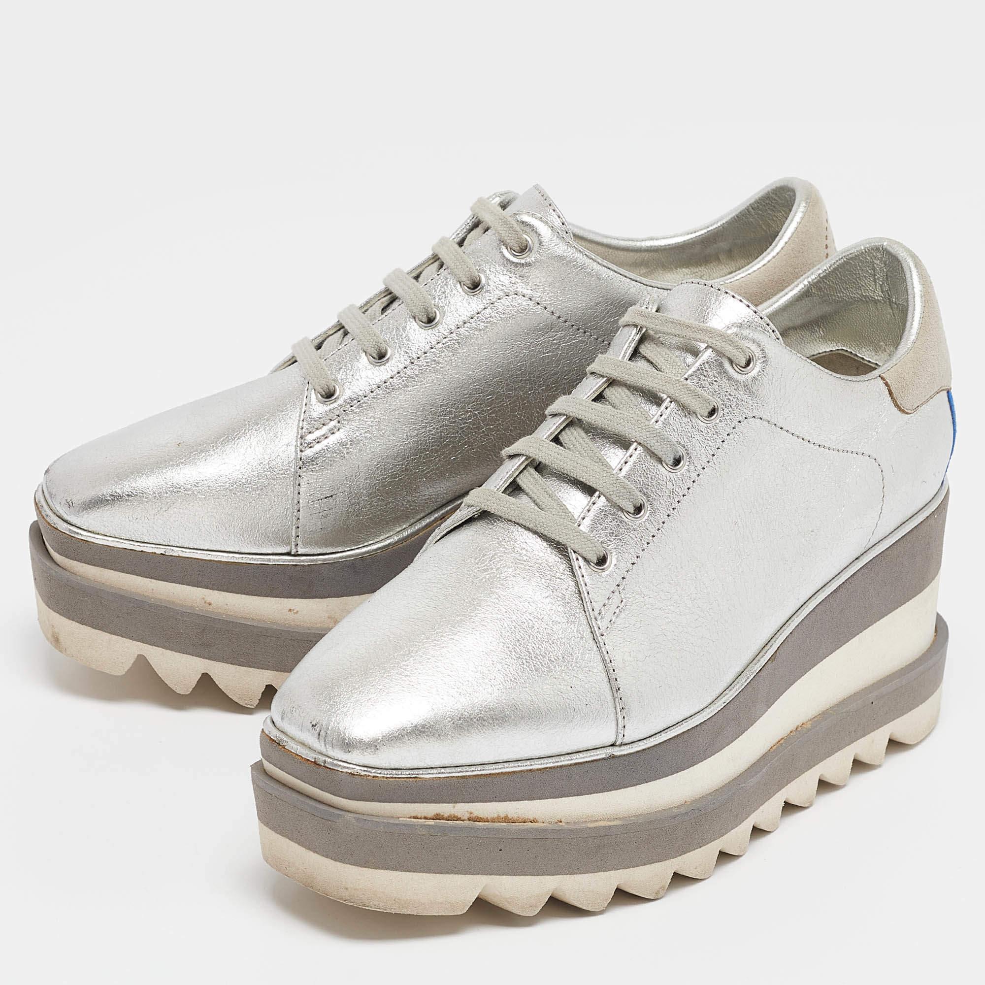 The striking silhouette of these Stella McCartney sneakers makes them highly fashionable. Constructed from faux leather  they feature lace up vamps  and rubber soles. The silver shade of this pair will complement various outfits in your closet.