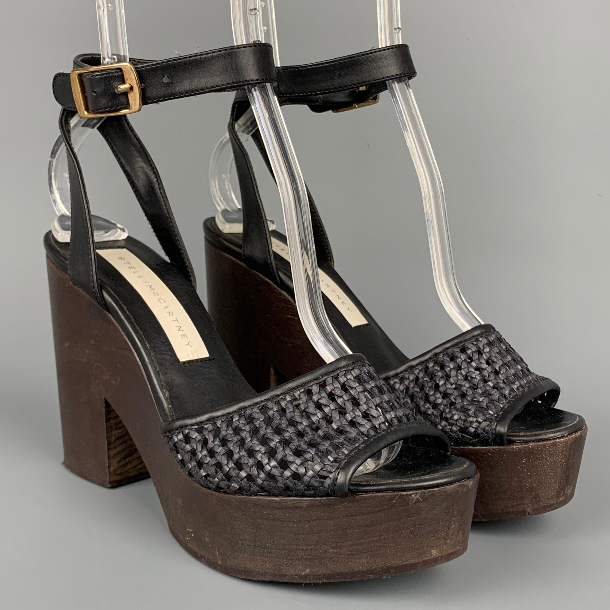 STELLA McCARTNEY sandals comes in a black & brown woven faux leather featuring a platform style, ankle strap, and a chunky heel. Made in Spain.

Very Good Pre-Owned Condition.
Marked: 36

Measurements:

Heel: 4.25 in.
Platform: 1 in. 