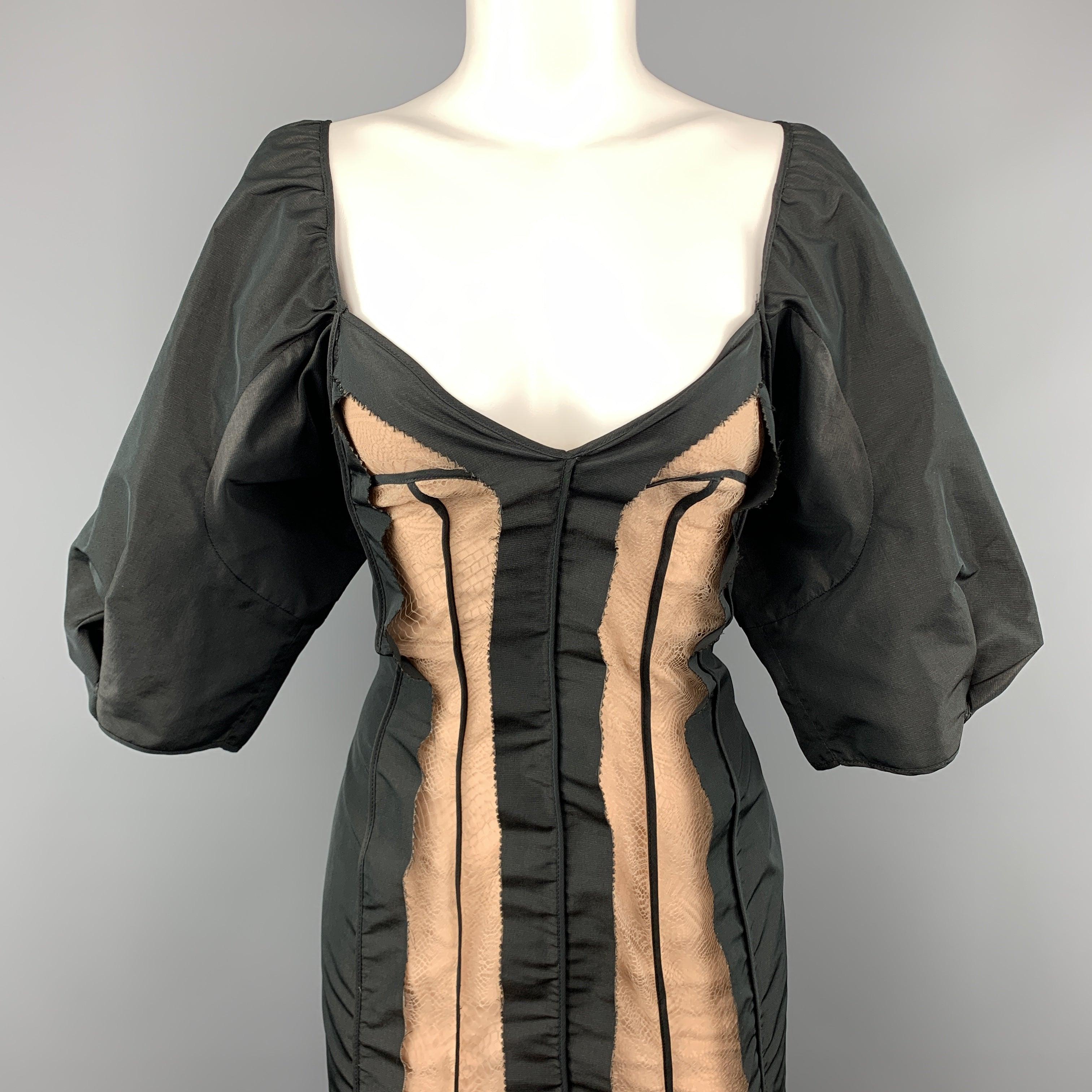 STELLA McCARTNEY cocktail dress comes in a black silk blend taffeta with a sweetheart portrait neckline, inside out effect raw seam constructions, beige lined lace mid panel, and balloon sleeves. Made in Italy.Excellent Pre-Owned Condition.