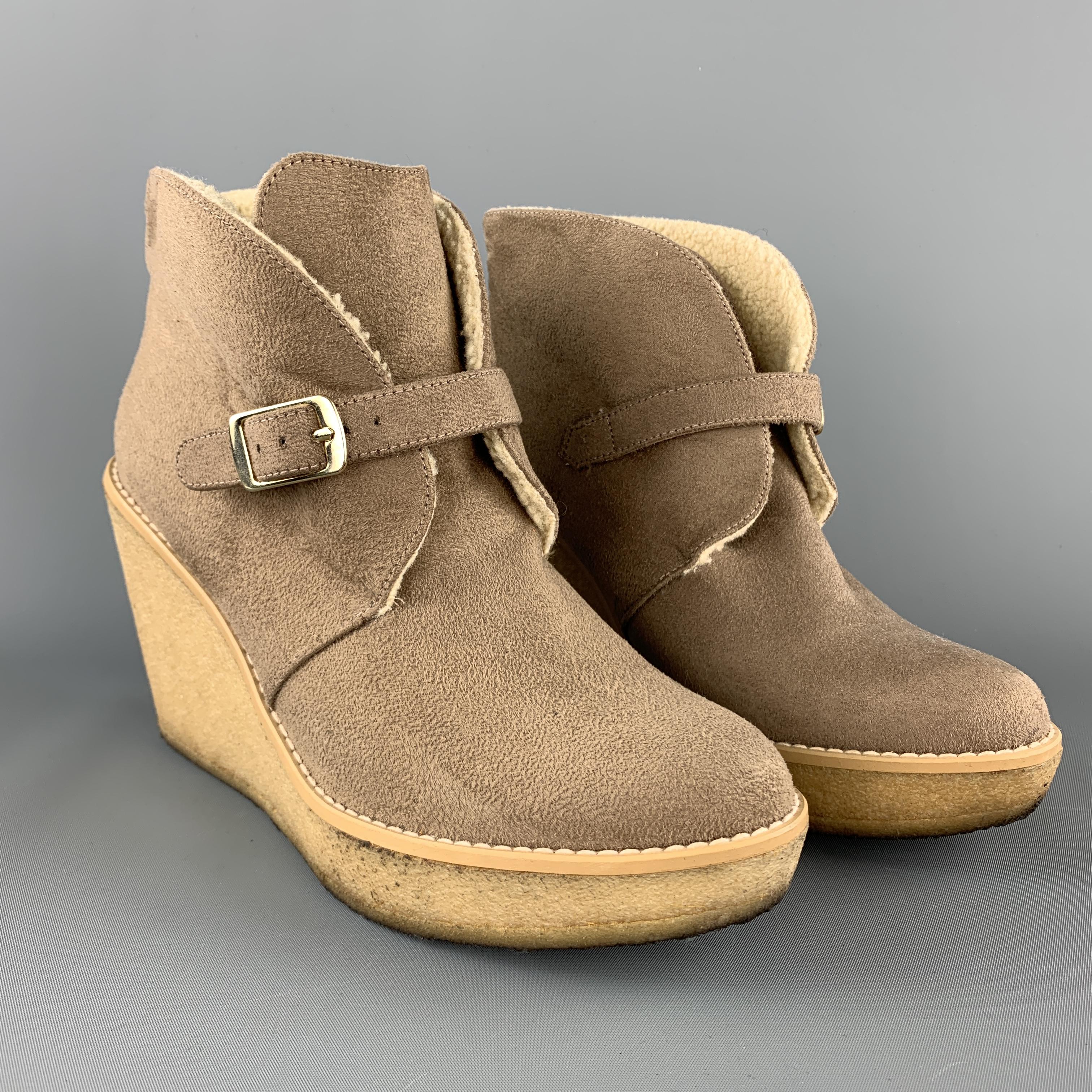STELLA MCCARTNEY ankle booties come in vegan faux shearling suede with a strap closure and gum wedge sole. Made in Spain.

Good Pre-Owned Condition.
Marked: IT 37

Measurements:

Heel: 3.75 in.
Platform: 1 in.