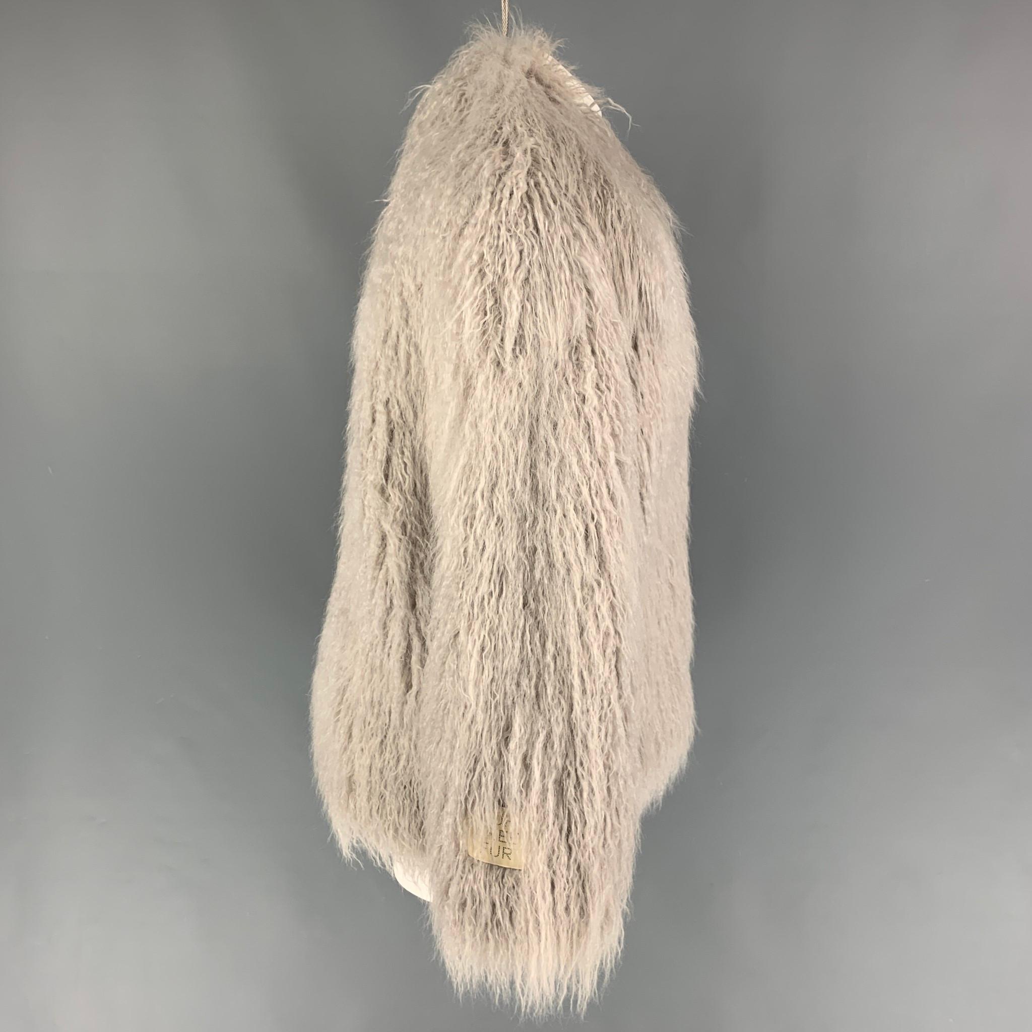 STELLA McCARTNEY 'Fur Free Fur' jacket comes in a grey modacrylic faux fur featuring a large collar, slit pockets, and a hook & loop closure. 

Very Good Pre-Owned Condition.
Marked: 42
Original Retail Price: $2,445.00

Measurements:

Shoulder: 18