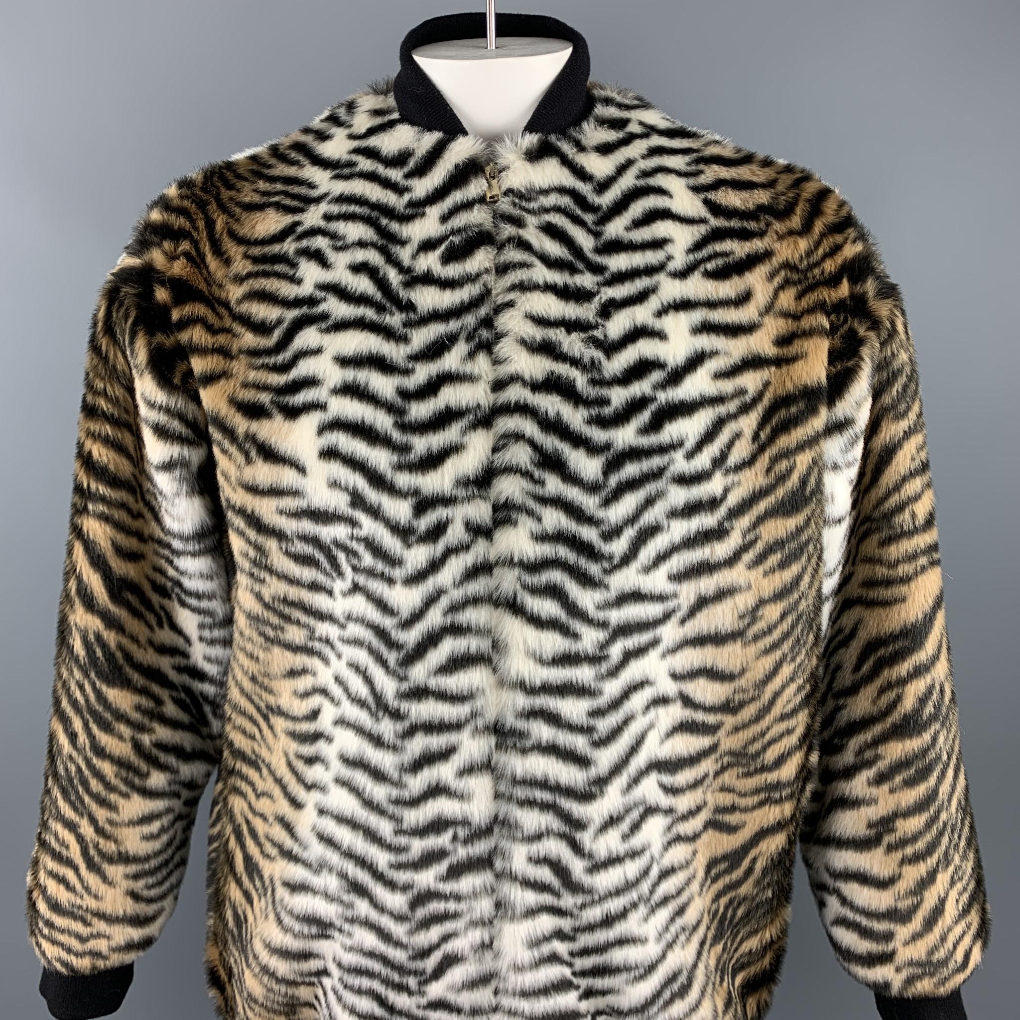 STELLA McCARTNEY jacket comes in a black & tan tiger print faux fur featuring a oversized bomber style and a zip up closure.

Excellent Pre-Owned Condition.
Marked: 38

Measurements:

Shoulder: 24 in. 
Bust: 48 in. 
Sleeve: 23 in. 
Length: 30 in. 