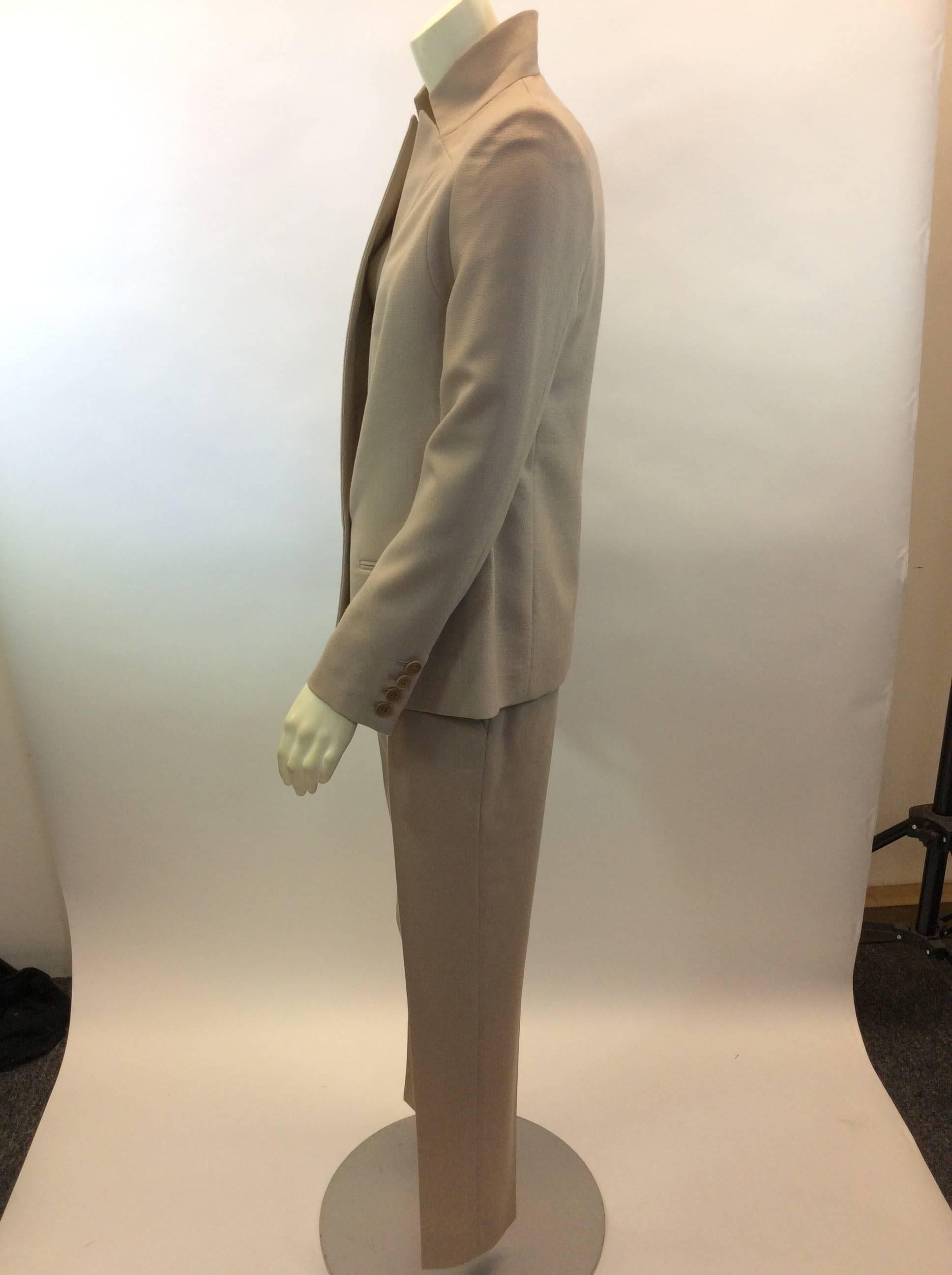 Stella McCartney Tan Pant Suit
Made in Hungary 
$599
100% Wool
Size 42
Jacket:
Length 26