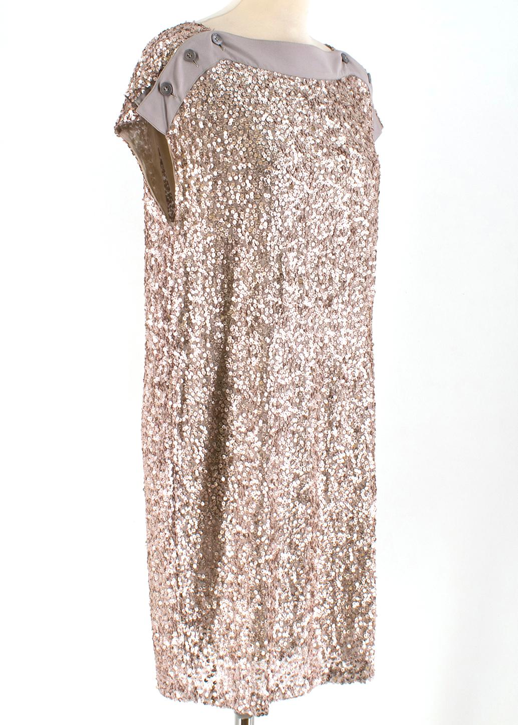 Stella McCartney Taupe Sequin Shift Dress

-Silk and sequin body
-gold/taupe tones
-Short-sleeved 
-Functional buttons on sleeves
-Silk lining

Please note, these items are pre-owned and may show some signs of storage, even when unworn and unused.