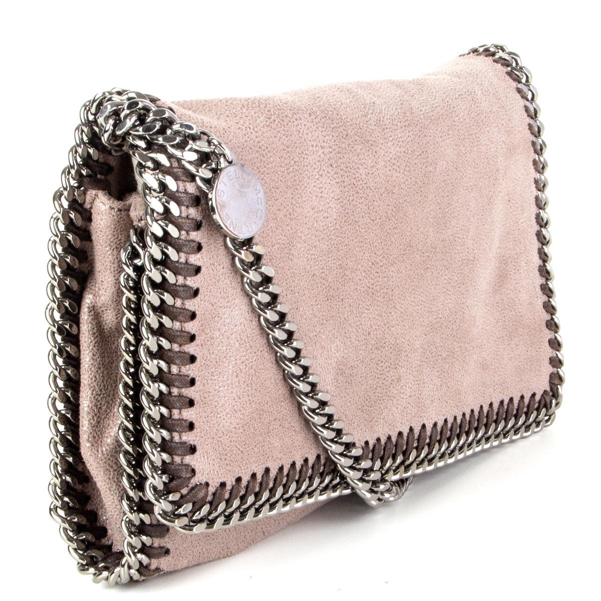 100% authentic Stella McCartney Falabella crossbody bag in taupe artificial leather featuring silver-tone shoulder-strap chain and trim. Opens with a magnetic button under the flap and is lined in pale rose nylon with one open pocket against the