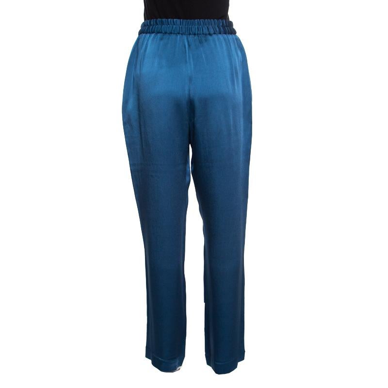 Stella McCartney's pretty teal trousers are designed with wide legs. They are crafted with a blend of fabrics. The easing silhouette of these trousers makes them a comfortable piece of clothing which, when paired with a fitted blouse, gives you a
