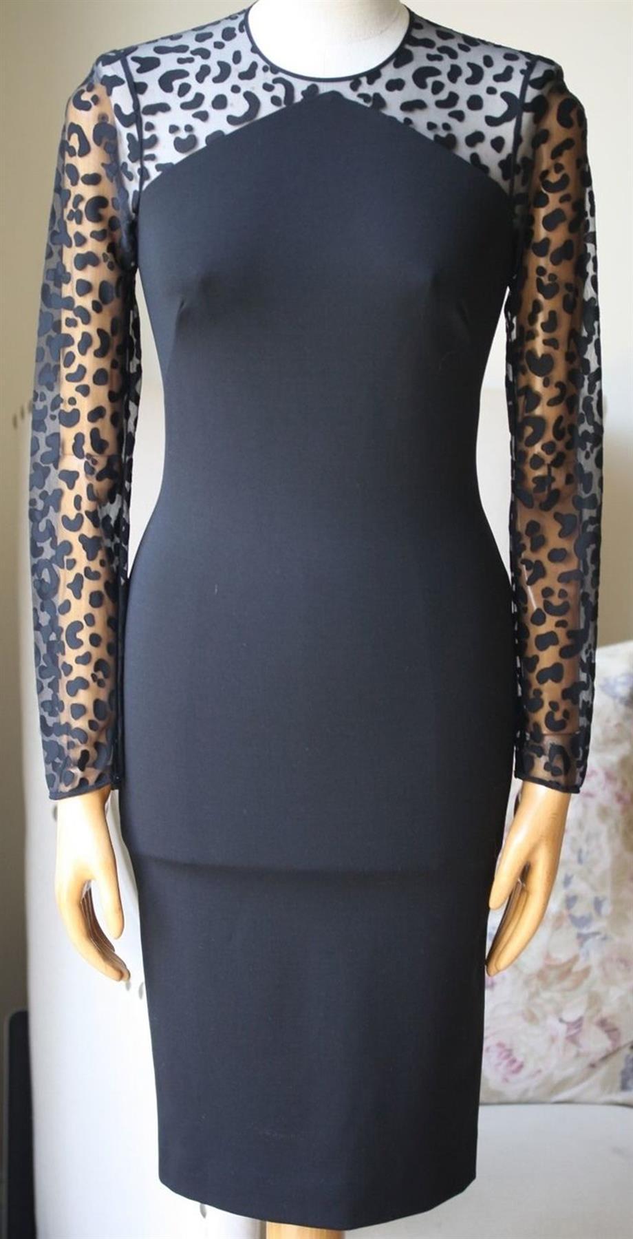 Stella McCartney's dress has a shimmery leopard tulle panel that allows for a modest flash of skin, it's cut from stretchy-jersey, woven with sustainable yarns and has a slim silhouette. Black stretch-jersey. Concealed zip fastening at back. 65%