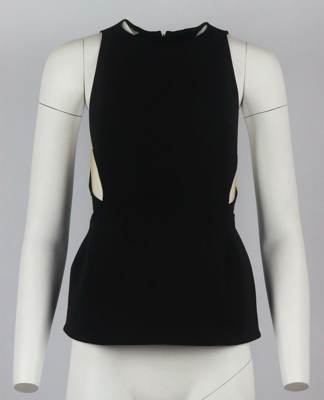 This top by Stella McCartney has a stretch-crepe bodice that flares out to a peplum silhouette with elegant layers of nude tulle at the sides.
Black stretch-crepe, nude tulle.
Concealed zip fastening at back.
34% Viscose, 34% polyamide, 24% wool, 8%
