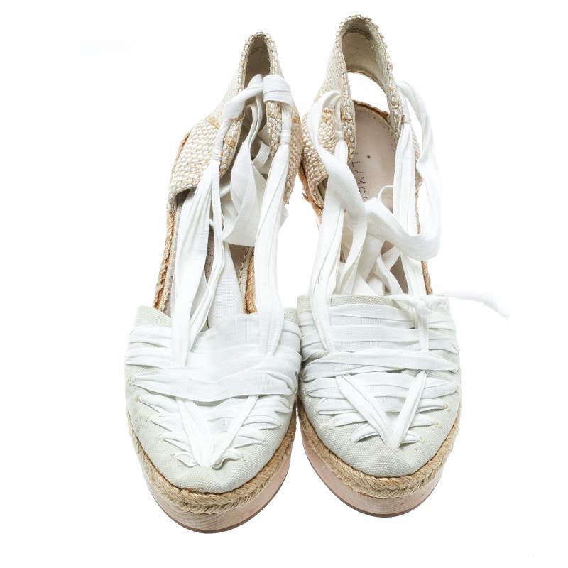 Charm your way with these fabulous sandals from Stella McCartney. Beautifully crafted, they carry closed toes and straps made of white canvas. The insoles are leather-lined to provide comfort and they flaunt an espadrille trim along with 10.5 cm