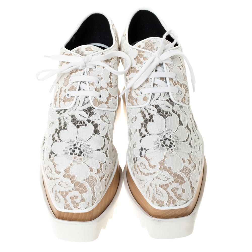 Stella McCartney exudes her high style and unique fashion taste with these white Elyse shoes. They are brimming with exquisite details like the intricate lace exterior, the laces, and the thick 8 cm platforms. They have lace-ups and durable rubber