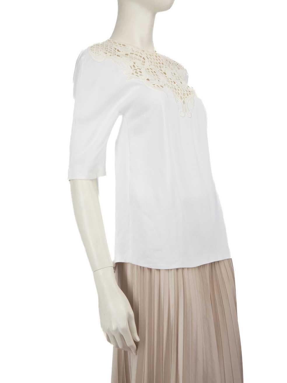 CONDITION is Very good. Minimal wear to the top is evident. There is a small mark on the back of the left shoulder and the brand label is loose on this used Stella McCartney designer resale item.
 
 
 
 Details
 
 
 White
 
 Viscose
 
 Top
 
 See