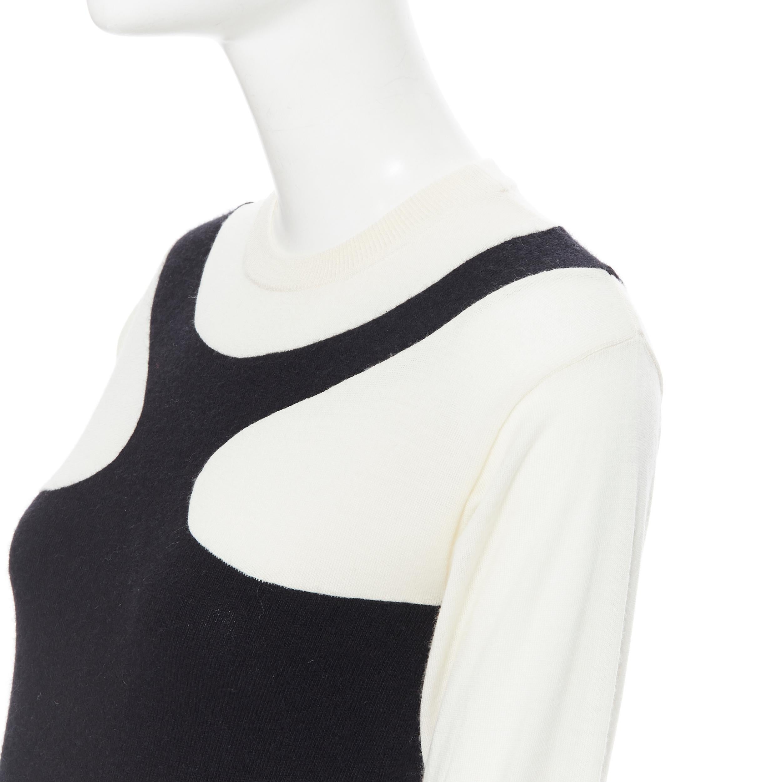 STELLA MCCARTNEY wool cashmere black white illusion colorblocked dress IT36 XS
Brand: Stella McCartney
Designer: Stella McCartney
Model Name / Style: Sweater dress
Material: Wool, cashmere
Color: Black, white
Pattern: Abstract
Extra Detail: Black