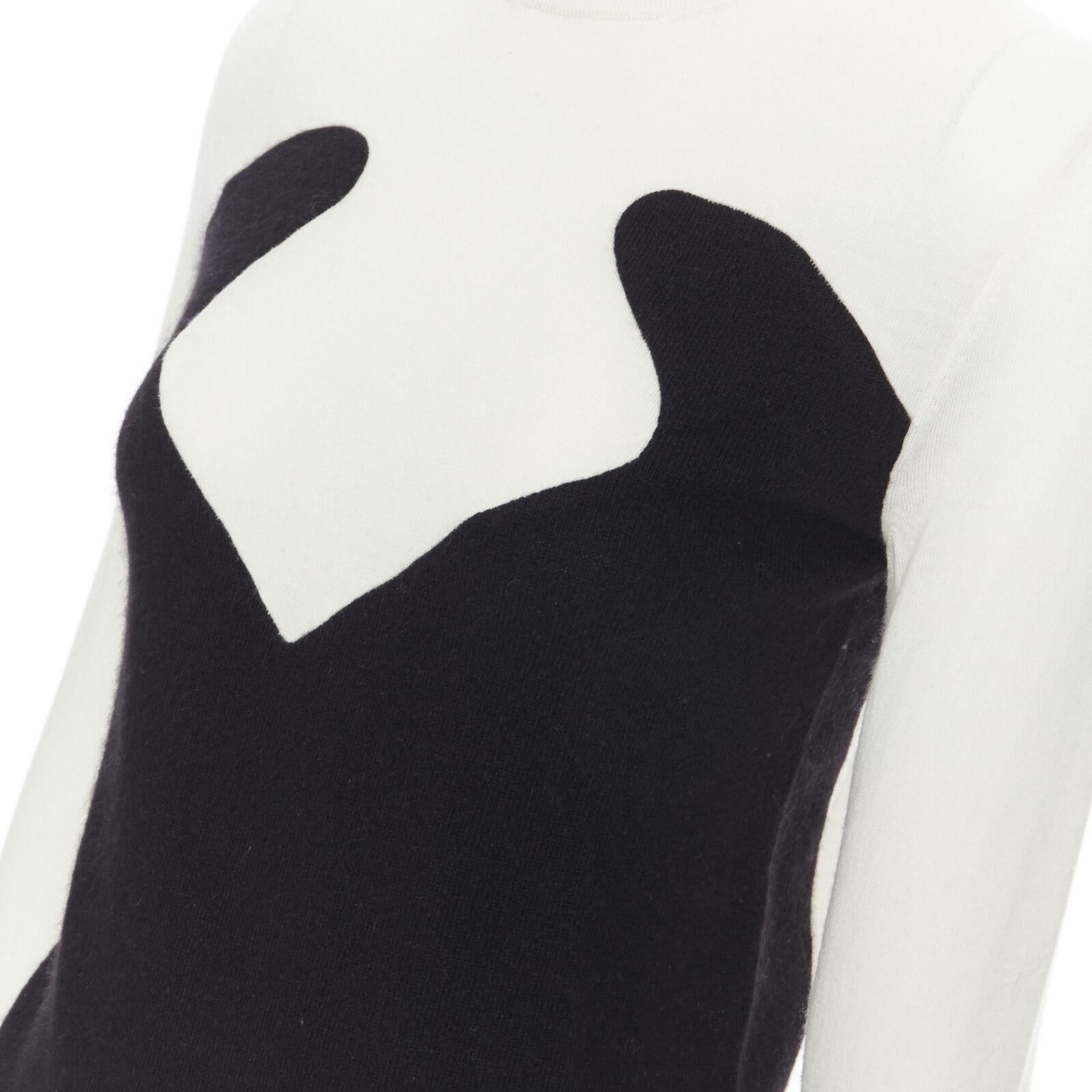 STELLA MCCARTNEY wool cashmere black white illusion turtleneck sweater IT36 XS
Reference: SNKO/A00082
Brand: Stella McCartney
Designer: Stella McCartney
Material: Wool, Cashmere
Color: Black, White
Pattern: Abstract
Extra Details: Black white