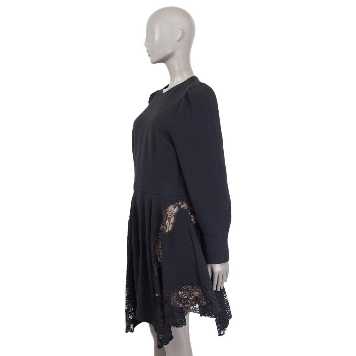 100% authentic Stella McCartney long sleeve dress in black viscose (49%), acetate (48%) and elastane (3%). Features a lace trim, slit pockets and buttoned cuffs. Opens with a zipper and a hook at the back. Lined in nude silk (100%). The buttons at