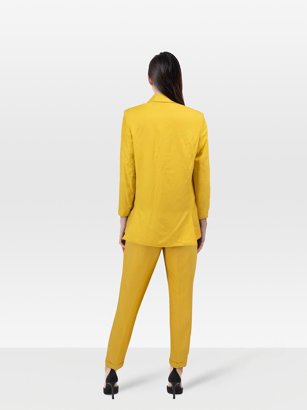 CONDITION is Very good. Minimal wear to set is evident. Minimal wear to blazer with loose stitching on the back. Discolouration marks on both trouser legs seen on this used Stella McCartney designer resale item.
 
 Details
 
 
 Yellow
 
 Viscose
 
