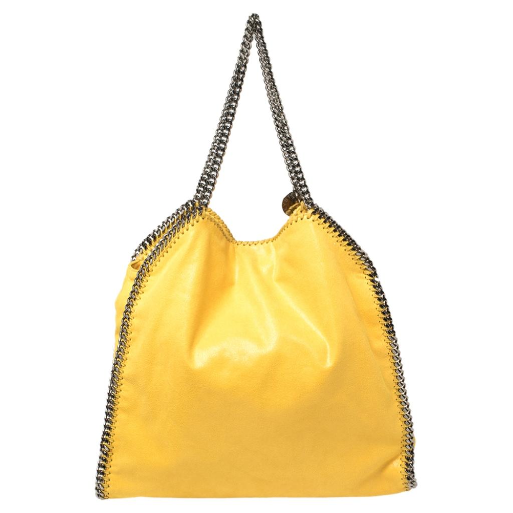 This Falabella shopper tote from Stella McCartney will make the dream of countless women come true. Crafted from faux suede, it is durable and stylish. While the chain detailing elevate its beauty, the fabric-lined interior will dutifully hold all