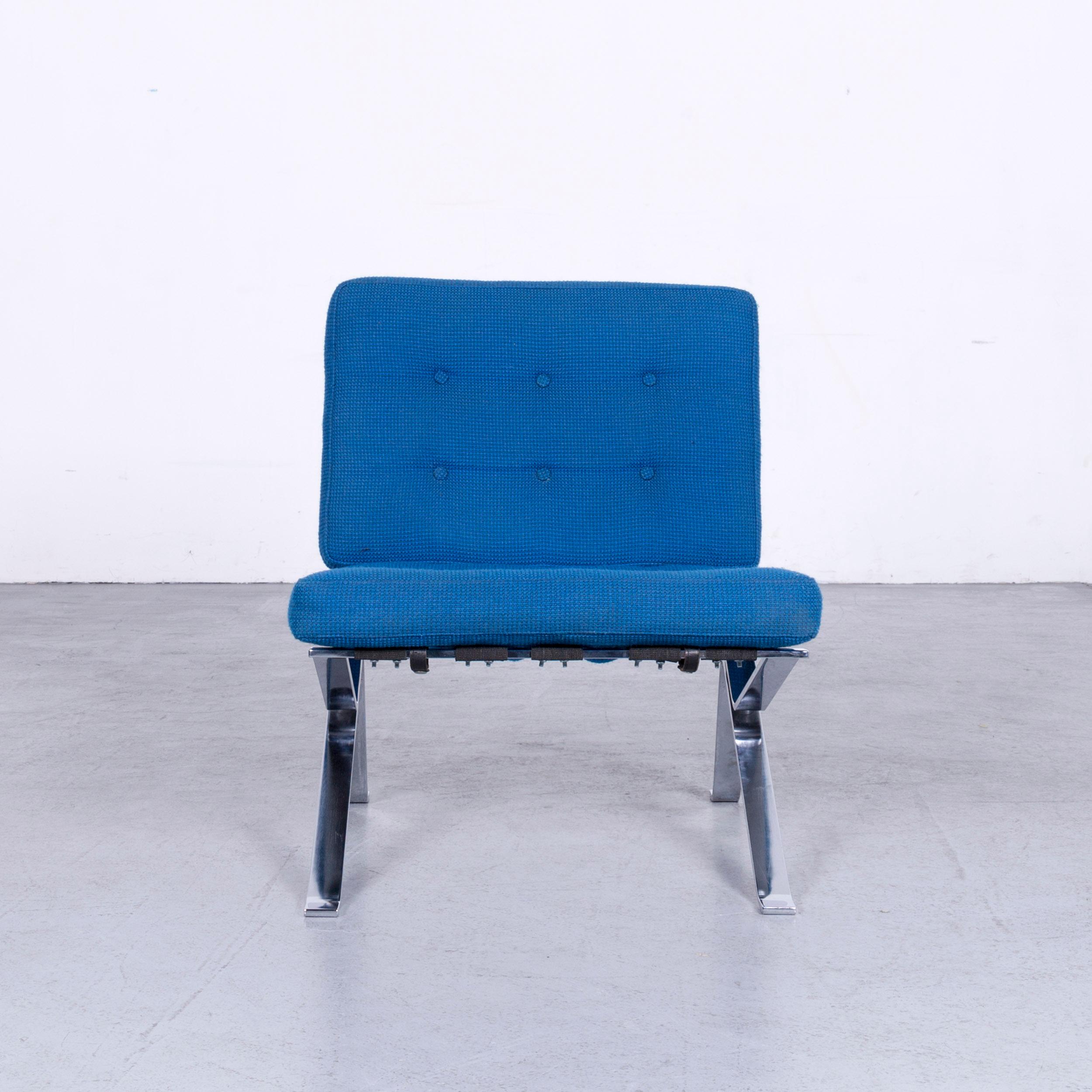 Blue colored original Stella Schweiz designer chair in a structured fabric, designed by Walter Frey.
