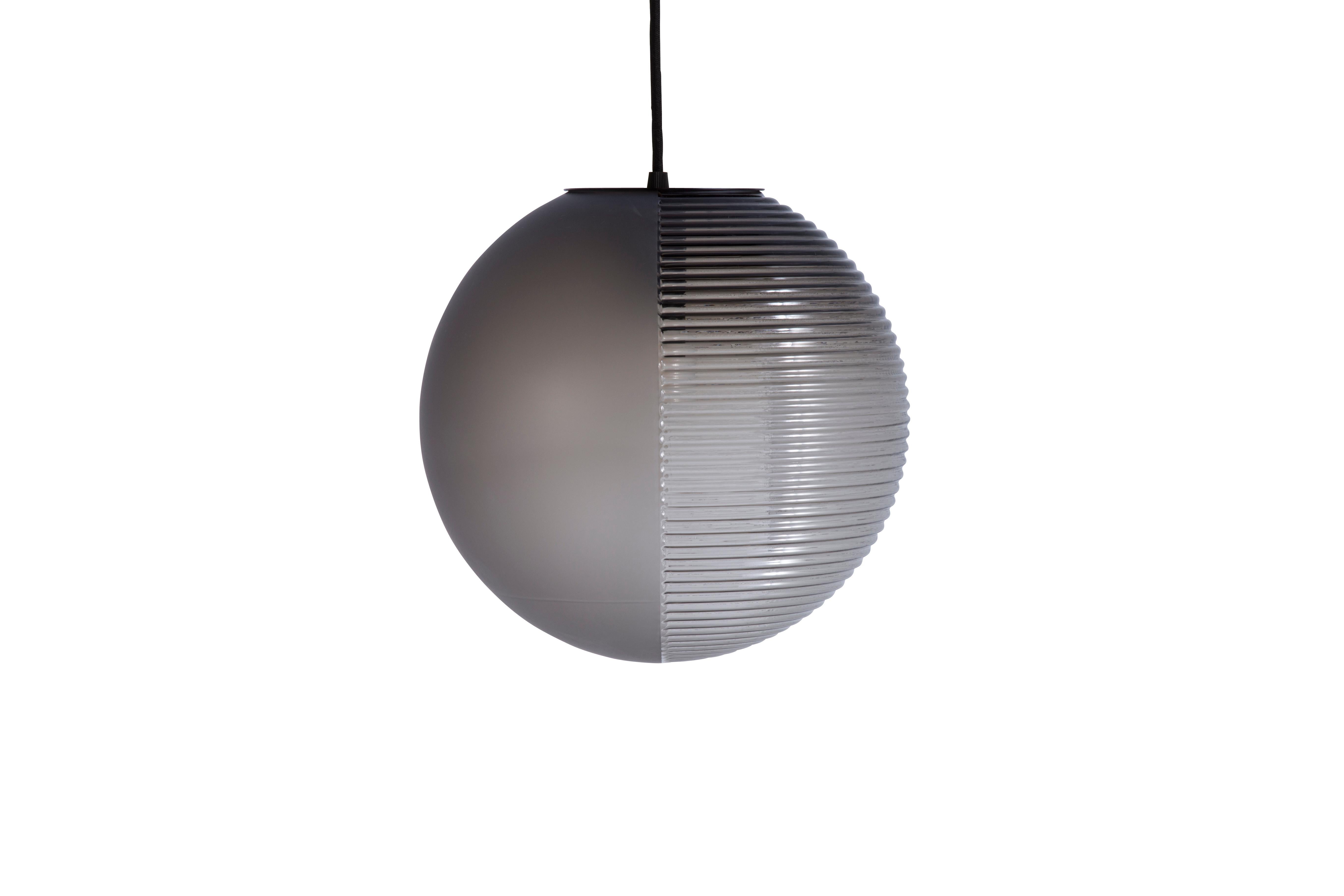 Stellar medium smoky grey Acetato smoky grey Pendant by Pulpo.
Dimensions: D31 x H320 cm
Materials: handblown glass coloured, stainless steel wire, textile cable.

Also available in different finishes: aubergine acetato aubergine, smoky grey