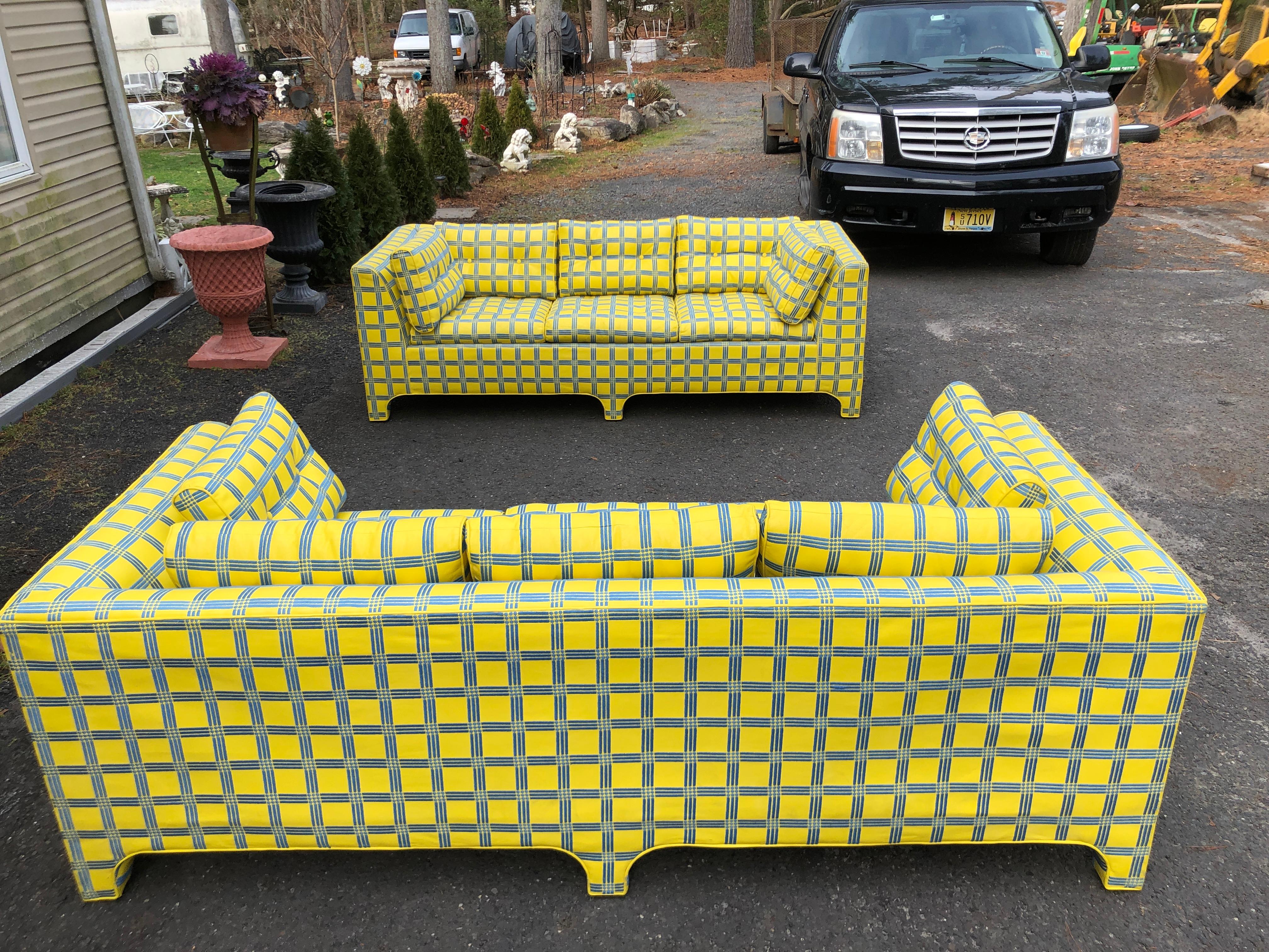 Stellar pair of Milo Baughman yellow leather parsons sofas.  This pair is in remarkable vintage condition with only light signs of age.  The magnificent yellow leather has embroidered blue lines creating a plaid effect-just gorgeous!  If you looking