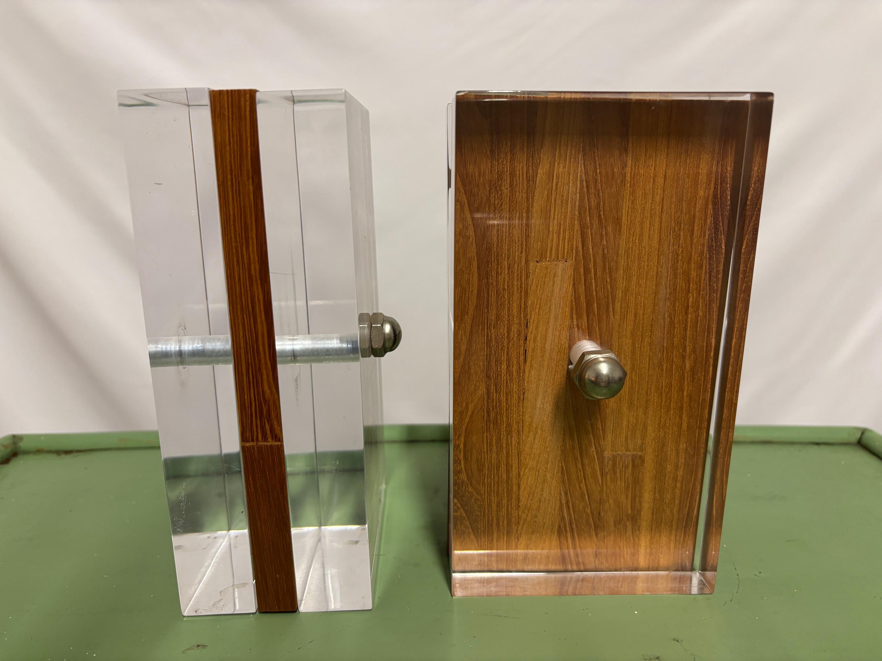 Enhance your pace with these exquisite lucite bookends, crafted by Herbert and Shirley Ritts, parents of famed photographer Herb Ritts.

Their sleek, minimalist design adds a touch of midcentury modern sophistication to any interior.
