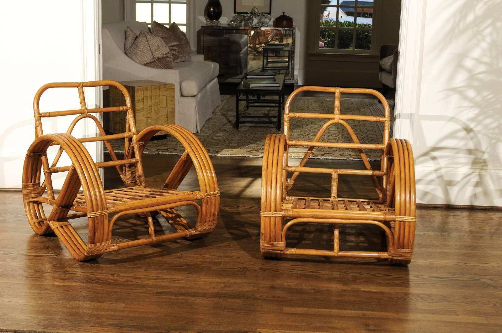 An exquisite pair of rattan round Pretzel lounge chairs, circa 1950. Stout, sturdy and expertly made pieces intended for heavy regular use. Stunning craftsmanship and quality. Exceptional room defining pieces aged to absolute perfection. The