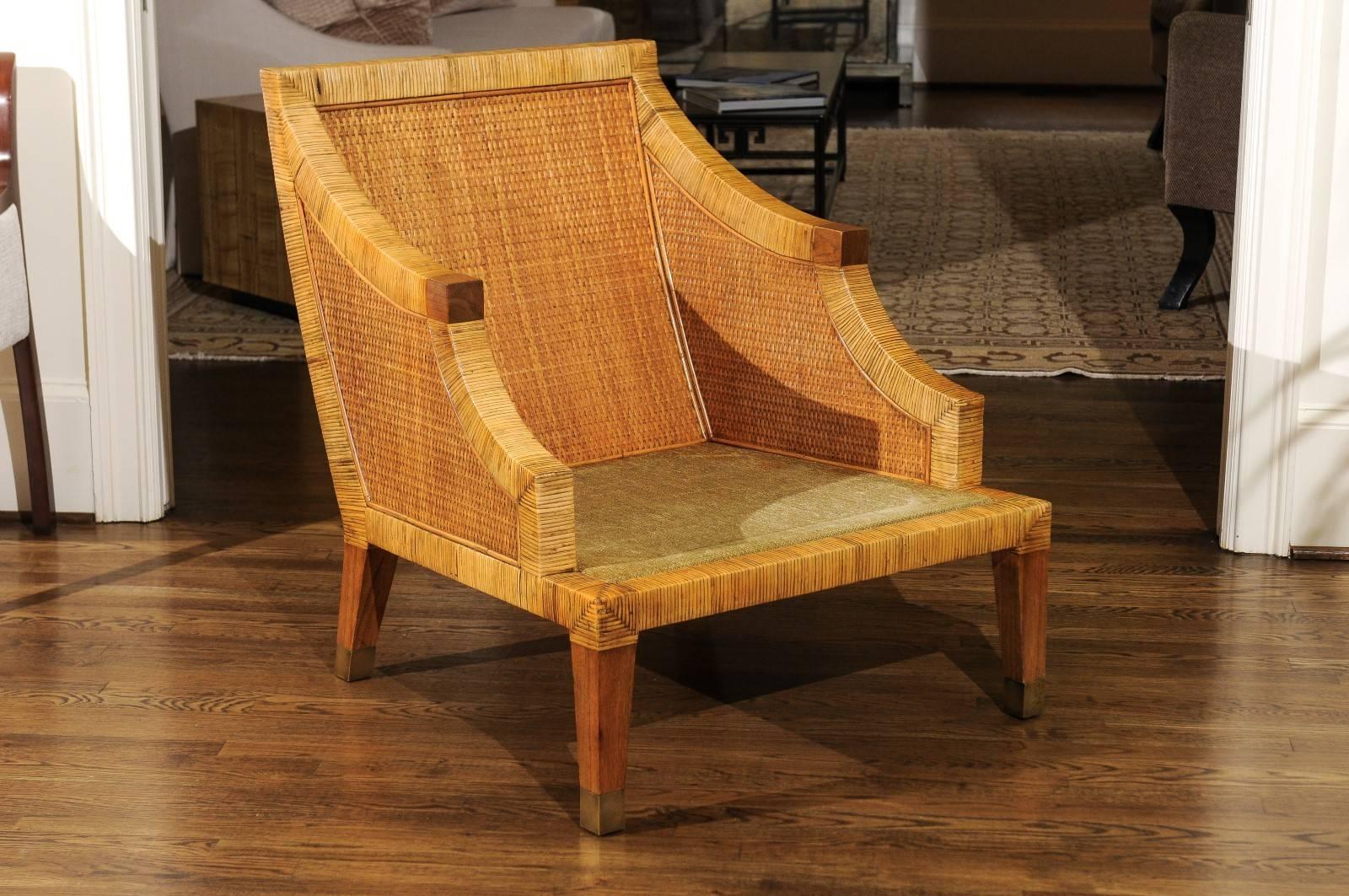A beautiful pair of large-scale club chairs by Bielecky Brothers, circa 1980. A boutique production design not often found. Expertly crafted hardwood form painstakingly wrapped in cane with raffia cane panel insets. Zebra Wood arm accents and legs;