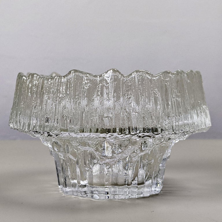 Tapio Wirkkala for Iittala, c. 1970
‘Stellaria’ candle tealight holder

Clear textured glass
Excellent condition

Dimensions, approx..:
Diameter 10.5cm, height 6.5cm, weight 295g.