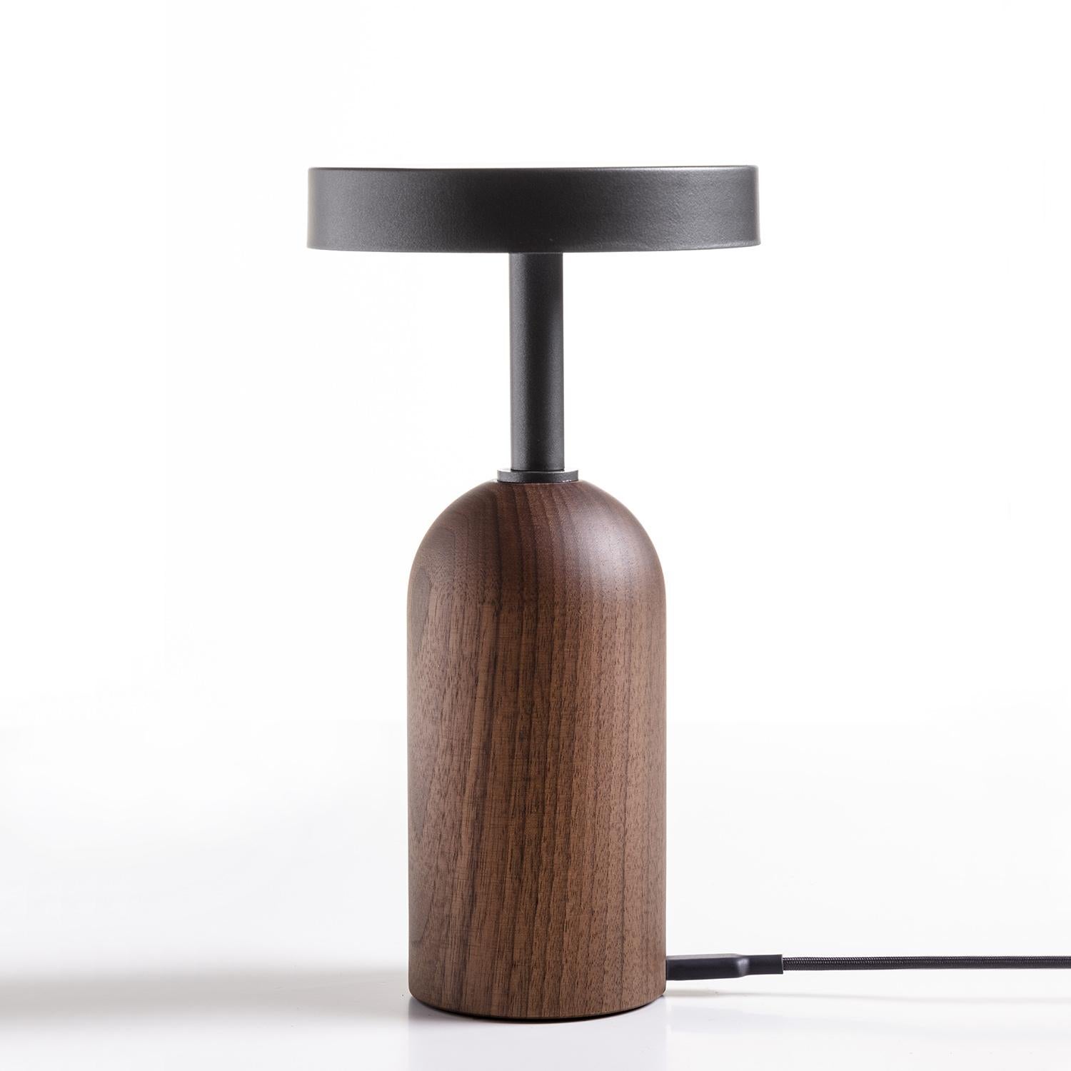 Table Lamp Stelle Light with base in solid walnut wood and with 
metal top in iron grey finish. Dimmable LED light wireless table lamp,
with switch mechanism with touch pad at the top of the diffuser, with
methacrylate diffuser. Includeing USB-C