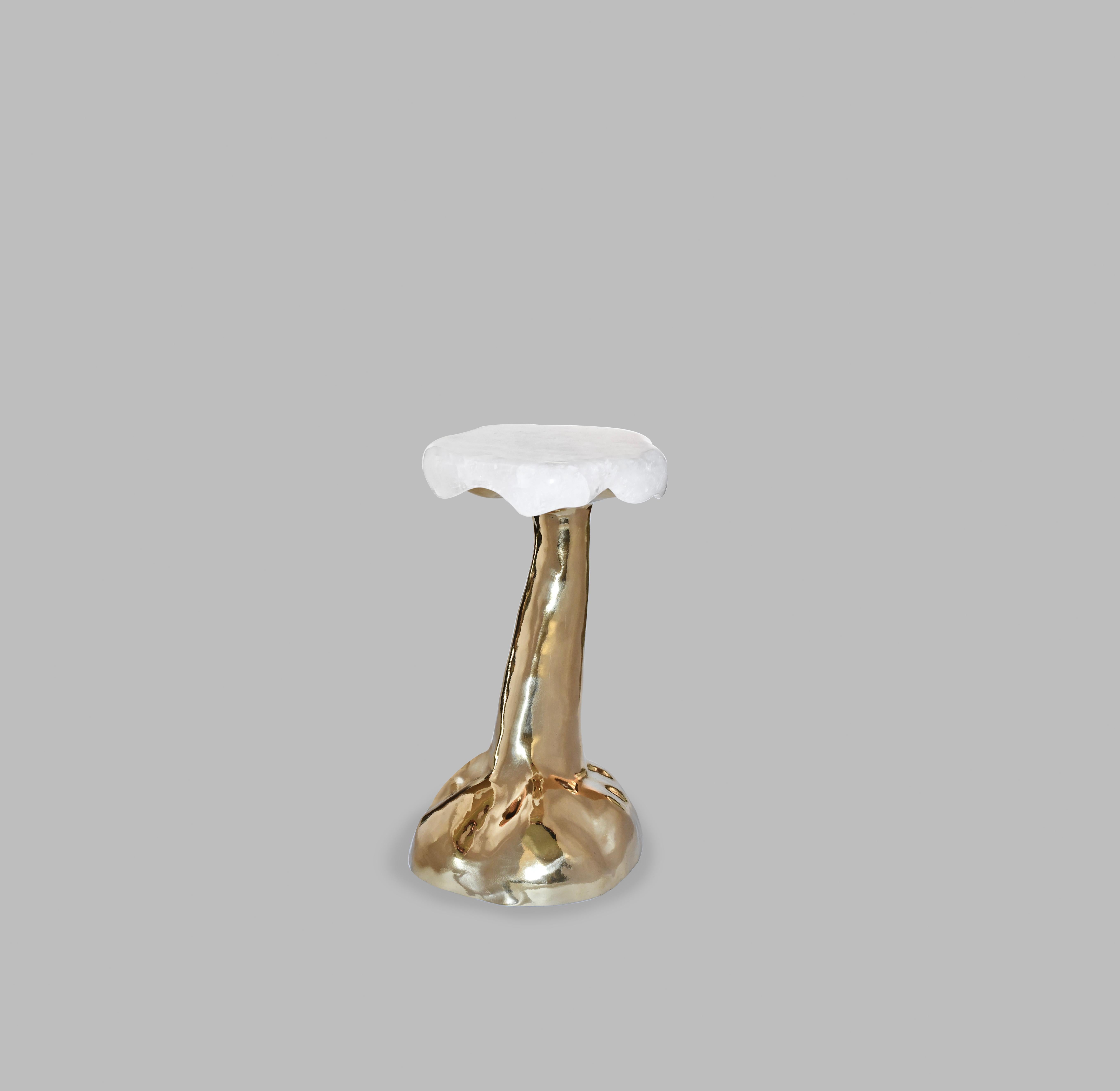 Sculptured accent table with finely carved rock crystal top. Polished brass finish. Created by Phoenix Gallery, NYC.