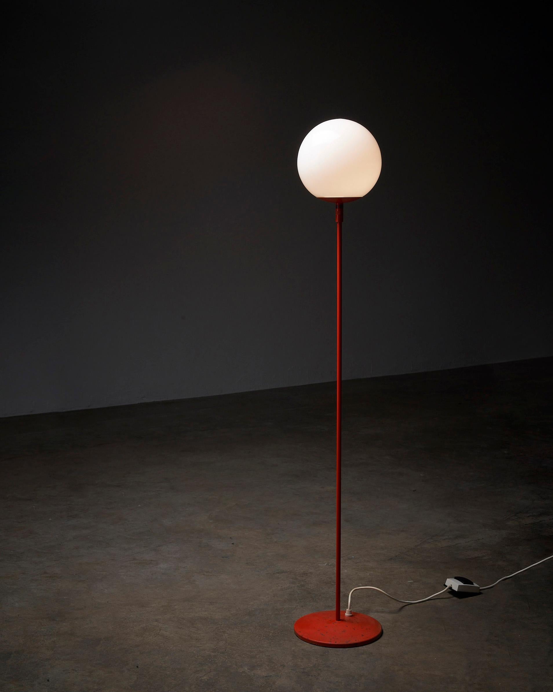 Introducing the Stem Floor Lamp with Glass Sphere, crafted by BAG Turgi, Switzerland. This minimalistic floor lamp showcases a sleek and understated design that effortlessly blends form and function.

The lamp features a thin, orange-colored stem