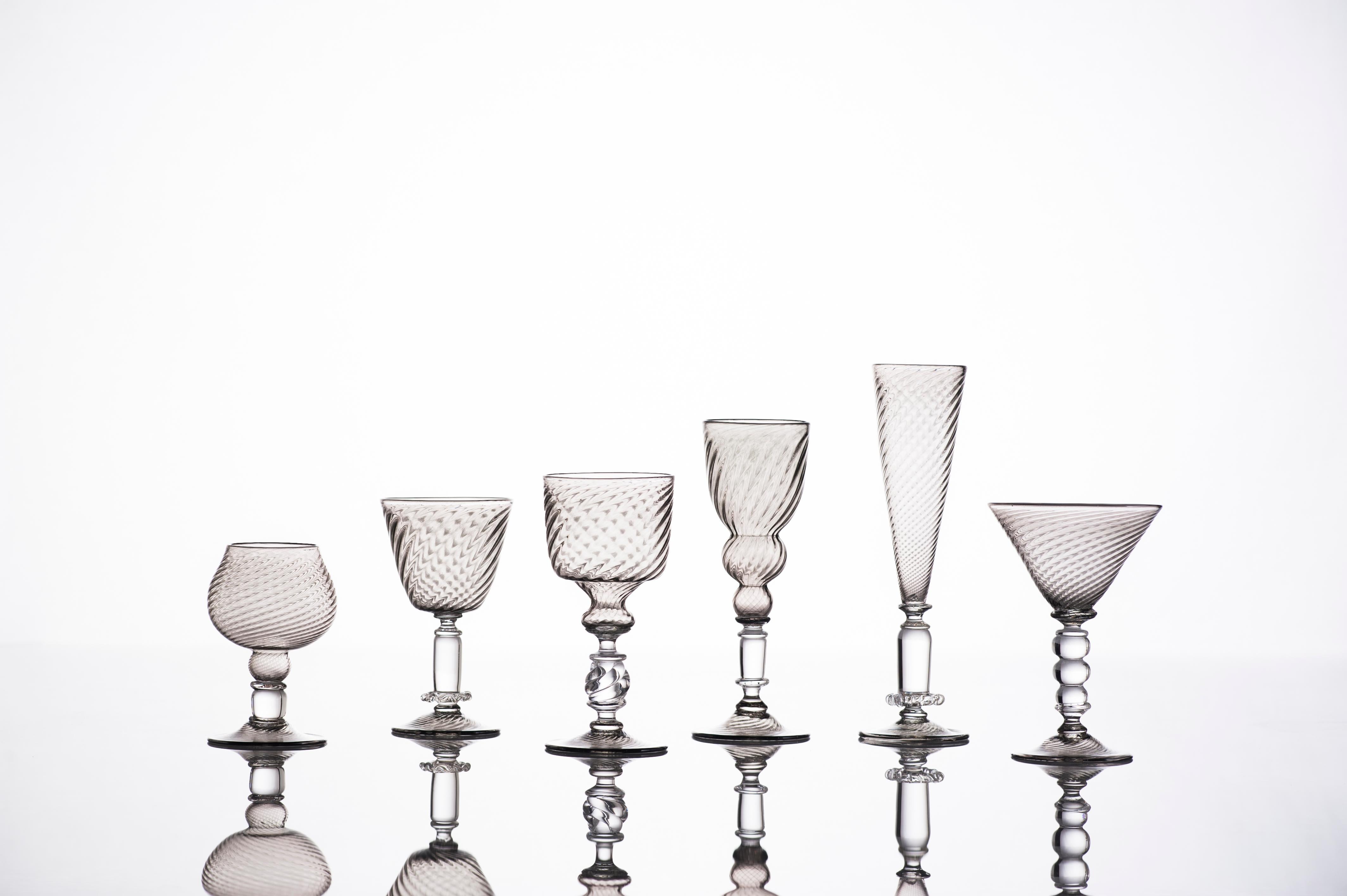 This timeless collection of stemware by Kazuki Takizawa makes a great gift or a sophisticated accent for your interior decor. Each piece is hand blown utilizing historical Venetian glassblowing techniques and uniquely designed with a modern twist.
